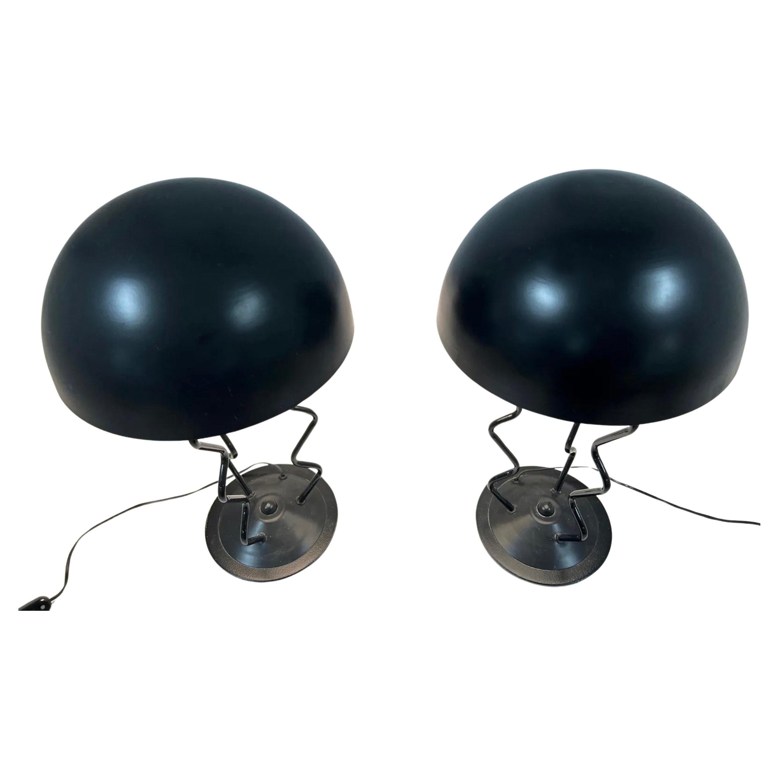 Pair of Memphis style Post modern steel squiggle lamps Black finish with large steel dome shades. Good vintage condition. Both Lamps work fine with a standard 120v American cord. Each lamp takes (1) standard Edison Socket light bulb. 

Dimensions: