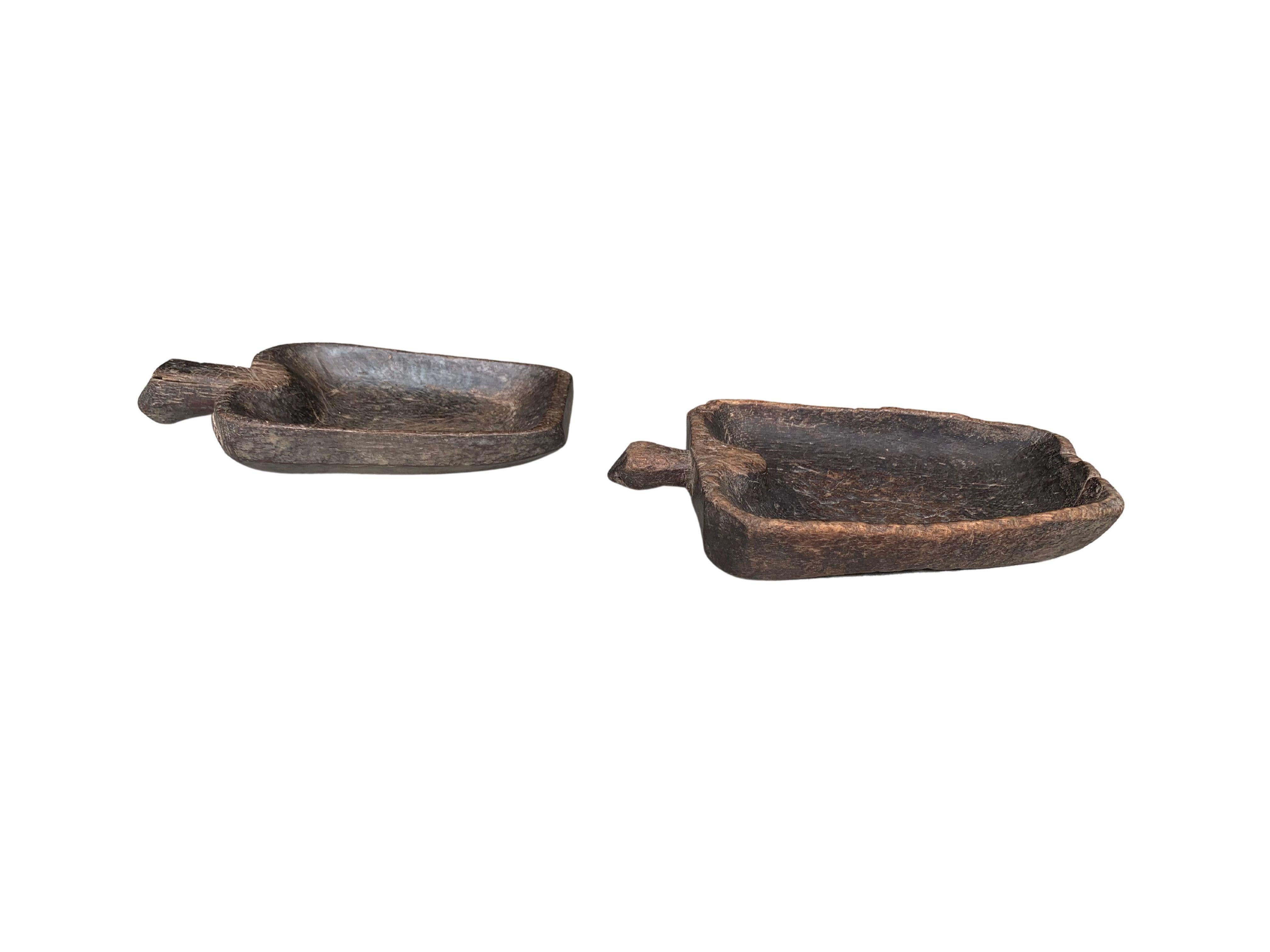 Crafted from ironwood these Mentawai tribal bowls feature handles and subtle wood detailing. Wonderful decorative bowls or table centrepieces certain to invoke conversation. The Mentawai tribes are situated on a series of islands off the western