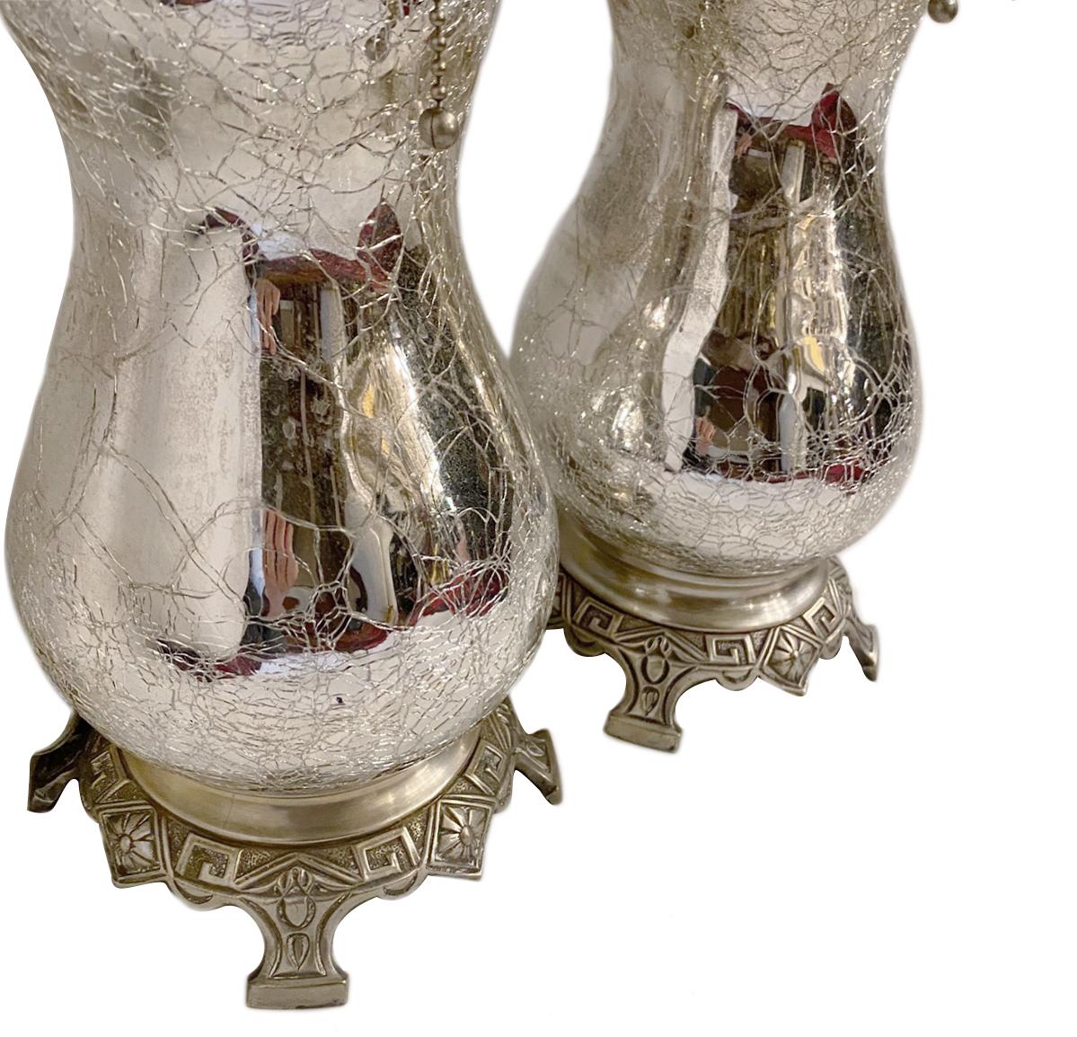 Pair of French circa 1920s crackled mercury glass lamps.

Measurements:
Height of body 15.5
