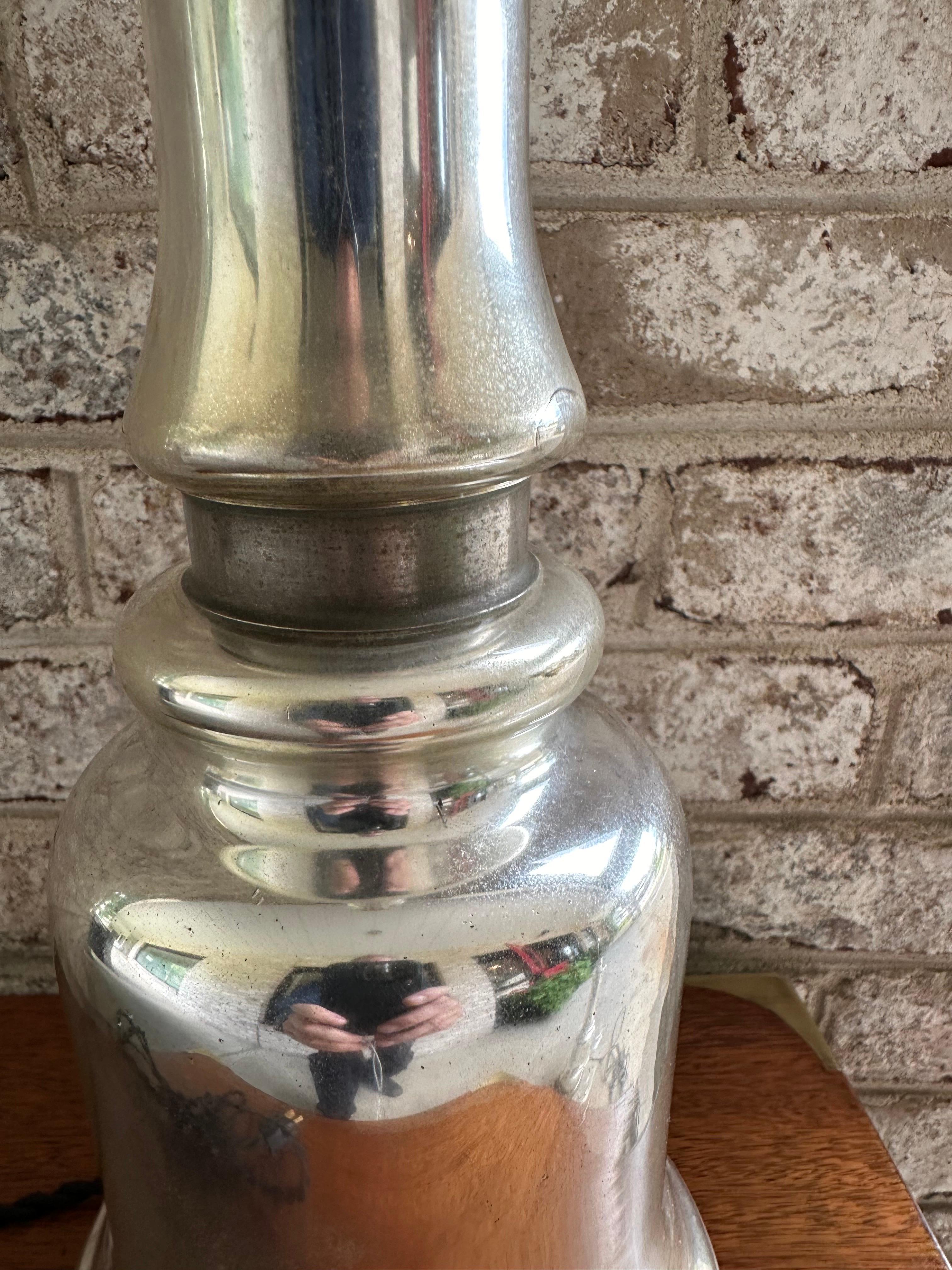Great pair of mercury glass lamps restored with new sockets and wiring in black silk covered twisted wire... new harps and brown felt bottom.... glass has a wonderful gentle patina as seen in photos.....