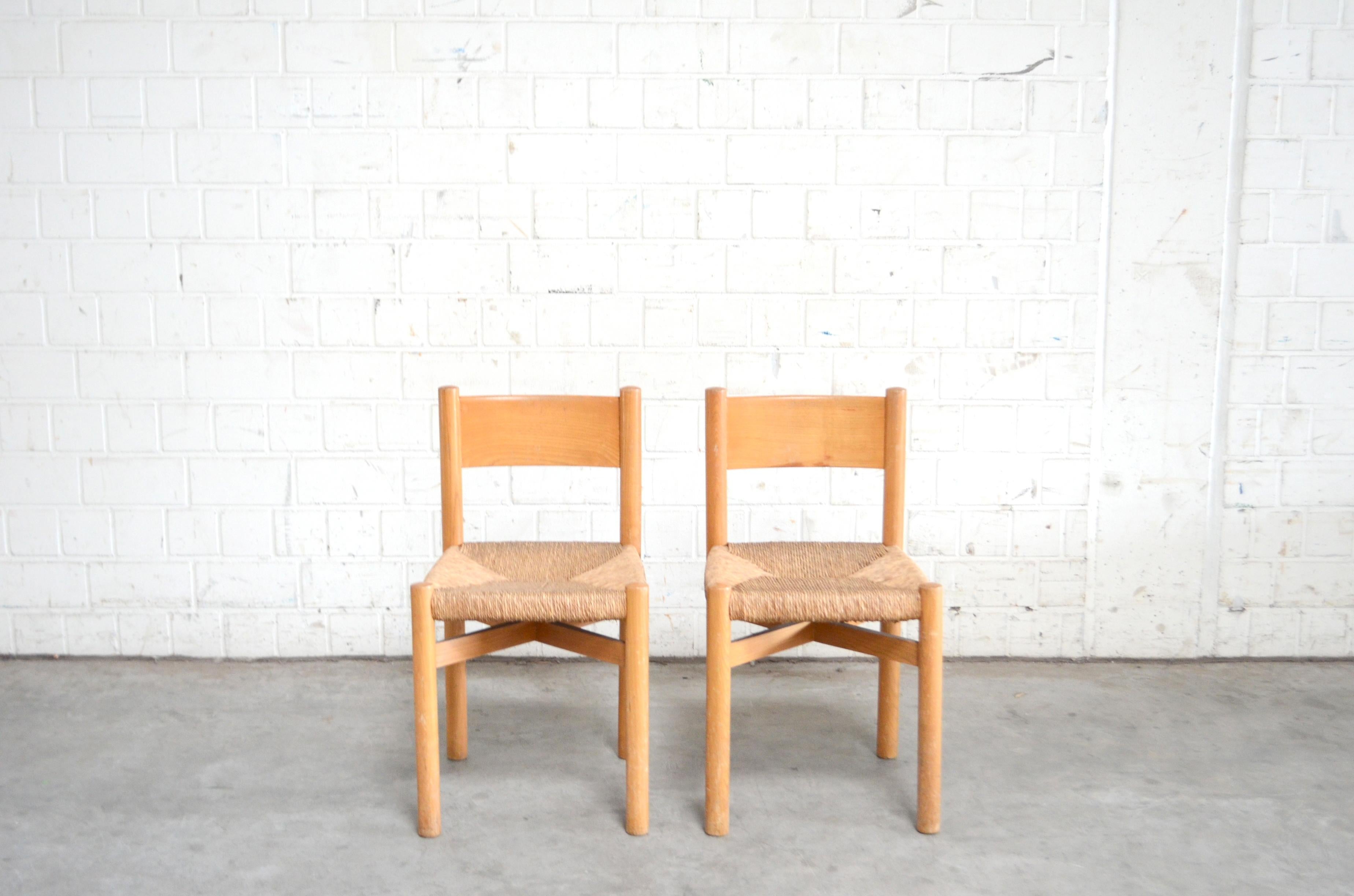 This pair of Meribel chairs is in original condition.

Design by Charlotte Perriand.
Lacquered oak wood and papercord.
Beautiful age of patina.
   