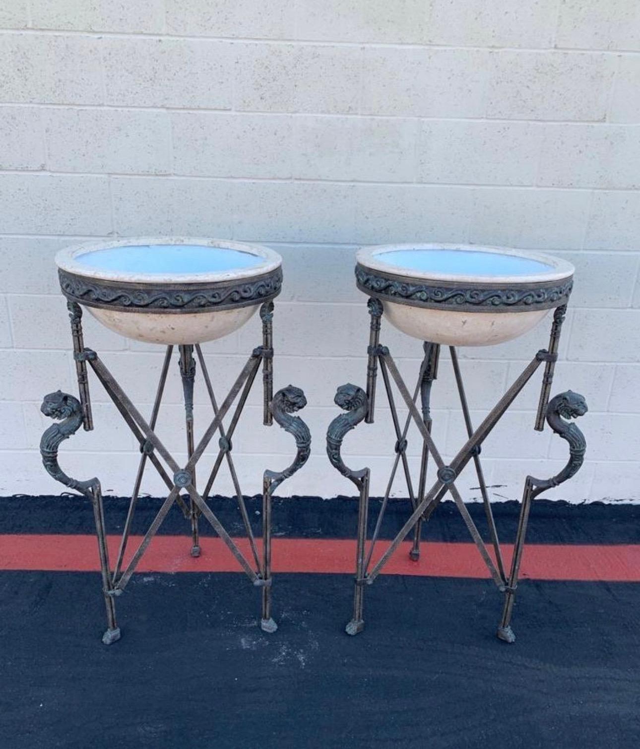 Wonderful pair of pedestal planters. From the 1980s. The bases are made out of metal and bronze. And the pot it is done of travertine. They are made by Maitland-Smith. And they are from Philippines. They have the label in the bottom of the pot, (you