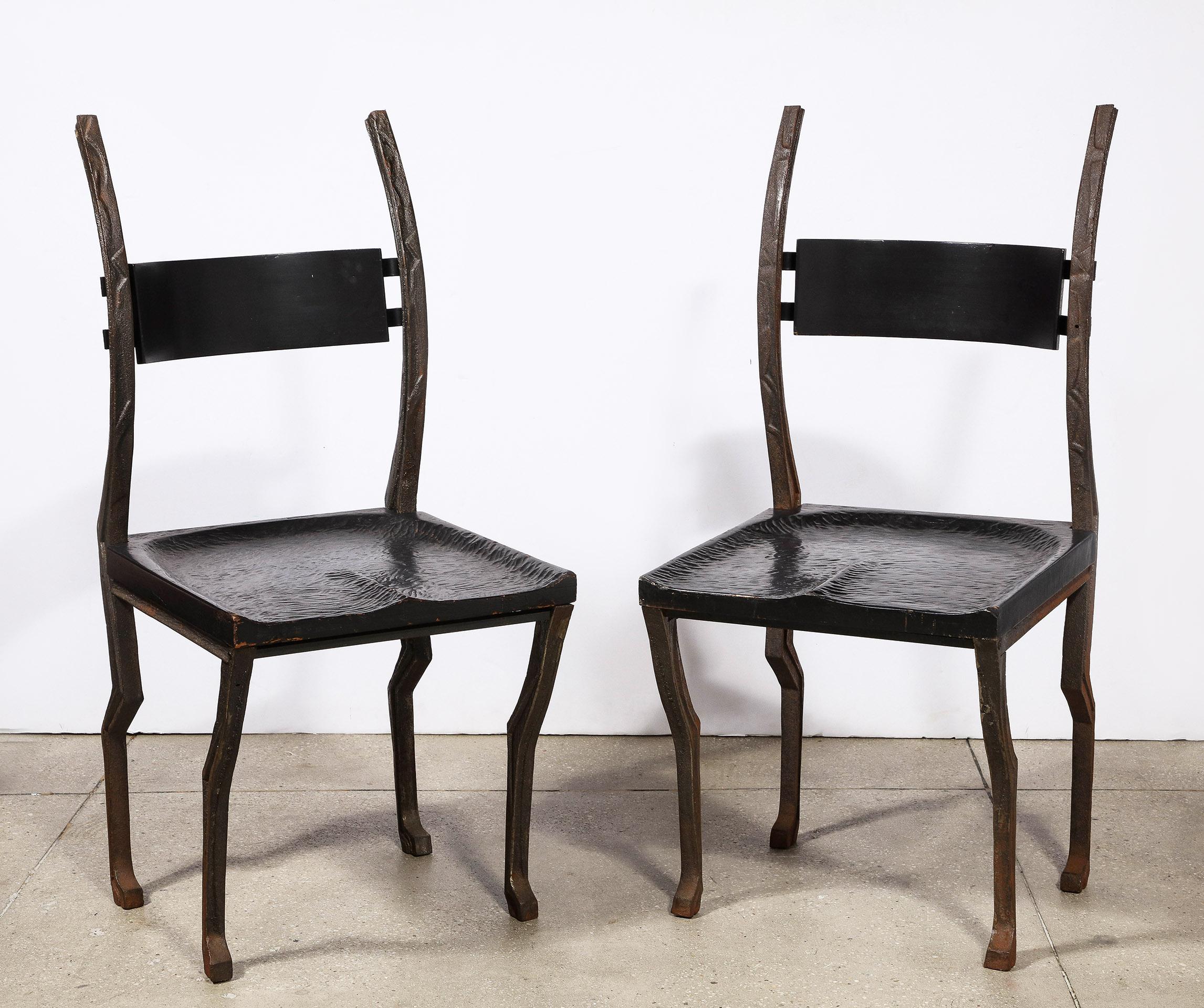 The rare sculpted chair constructed of forged steel with a hand-carved seat and back splat.