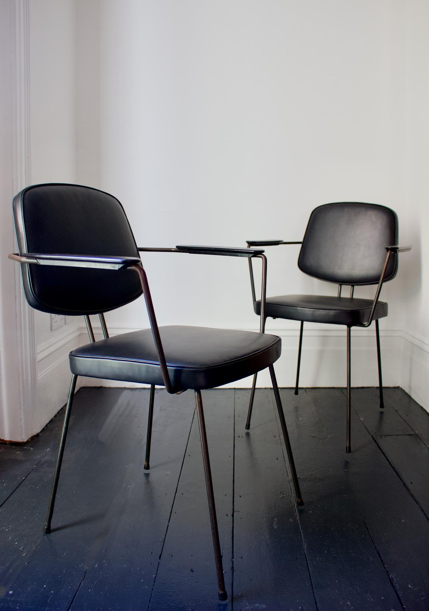 Pair of chairs designed by Rudolf Wolf for Elsrijk, re-upholstered in black leather. Netherlands, mid-20th century.

The chairs have a simple minimal design with the bent metal rod being the same for the legs and upper frame, which continues from