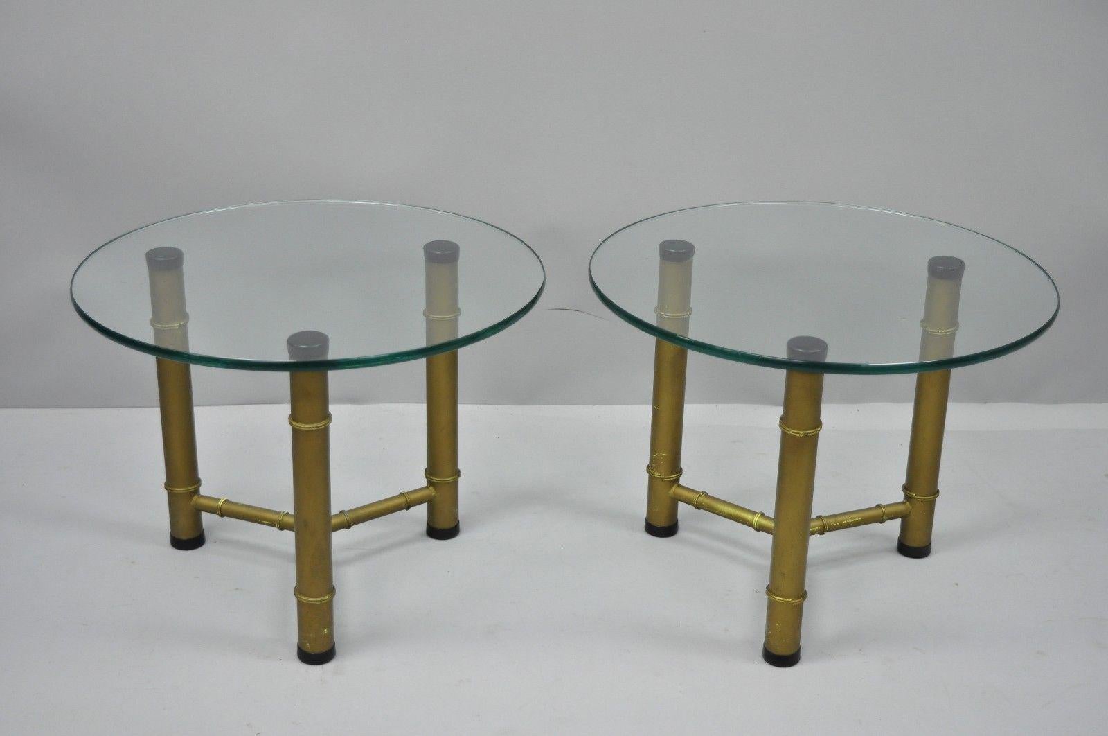 Pair of metal faux bamboo round glass top low sides tables. Item features metal faux bamboo tripod base, round glass tops, stretcher base, clean Modernist lines, great style and form, circa mid-20th century. Measurements: 14.75