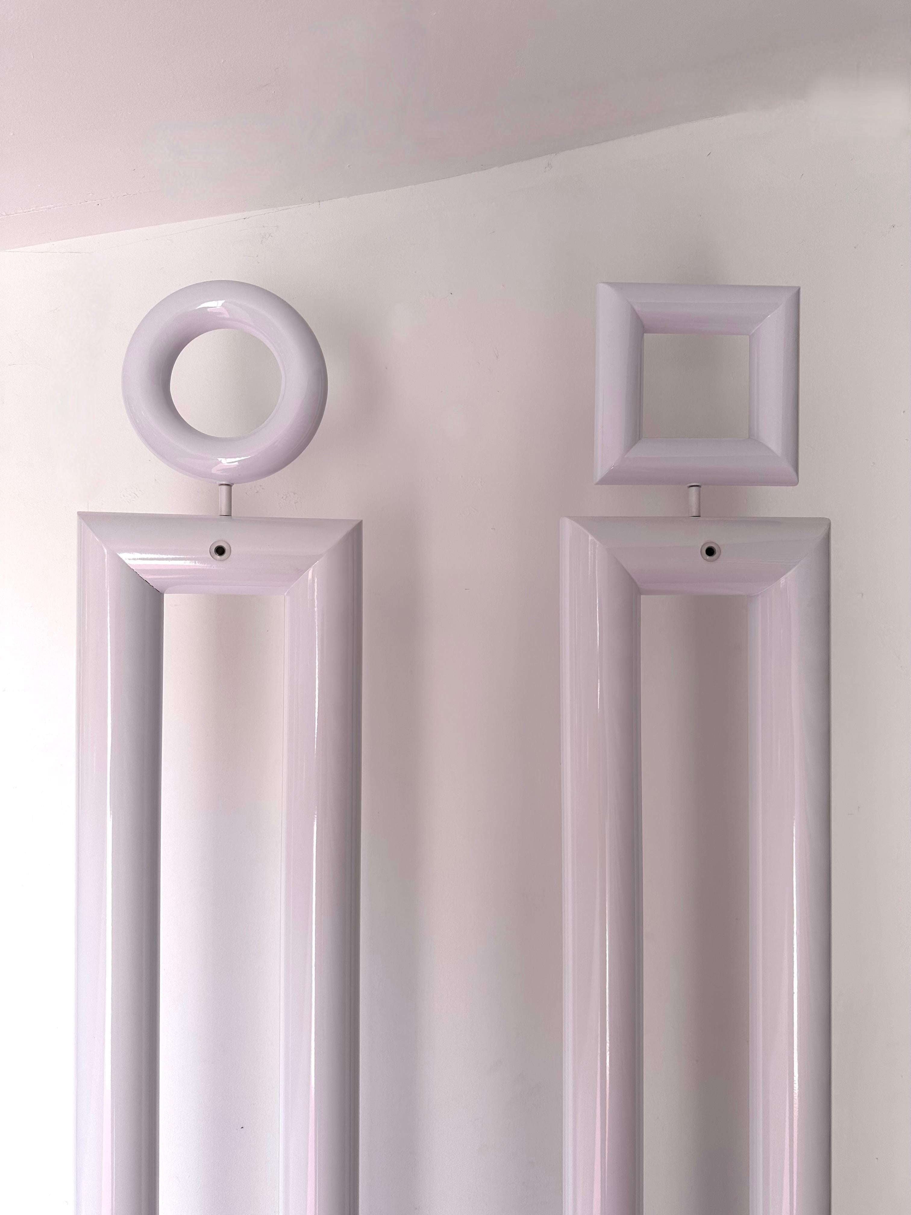 Rare pair of or set of 2 tall floor lamps boy and girl in white metal by the italian designer Remo Buti for the editor Neofos a division from Nordlight. Bibliography : The floor lamps were publicated in the famous design magazine Domus number 711
