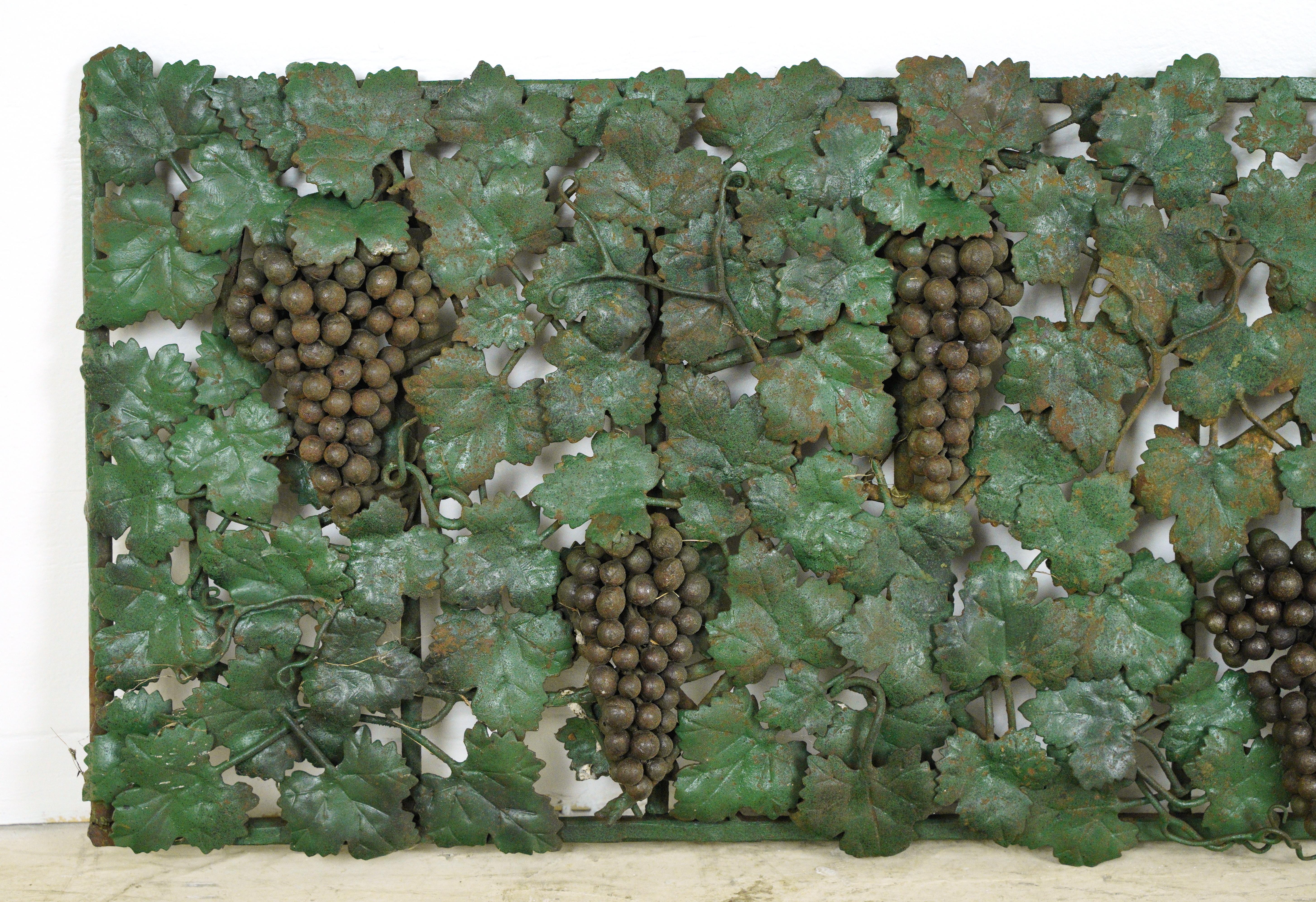 Green metal wall art pieces featuring leaves and grape bundles. One is rectangle shaped, and the other is draped and arched shaped. Great condition. Priced as a pair. Please note, this item is located in our Scranton, PA location.