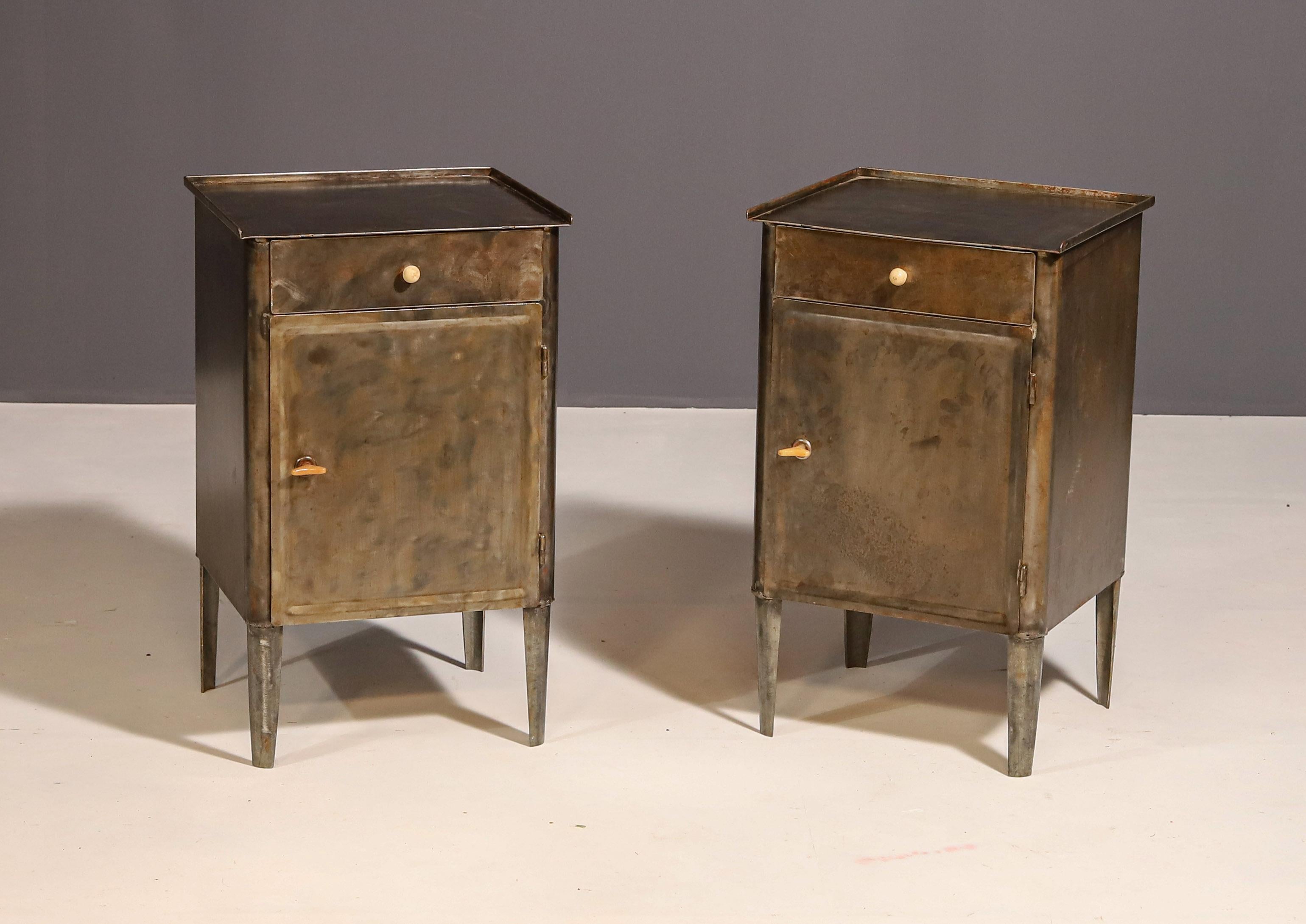 A pair of night stands in a industrial style.  Made in the former Czechoslovakia in the 1960´s.  It´s made of a brushed metal.
Overall in good condition, showing signs of age and using. Price is for the pair.

Price is for the pair.

Height: 70 
