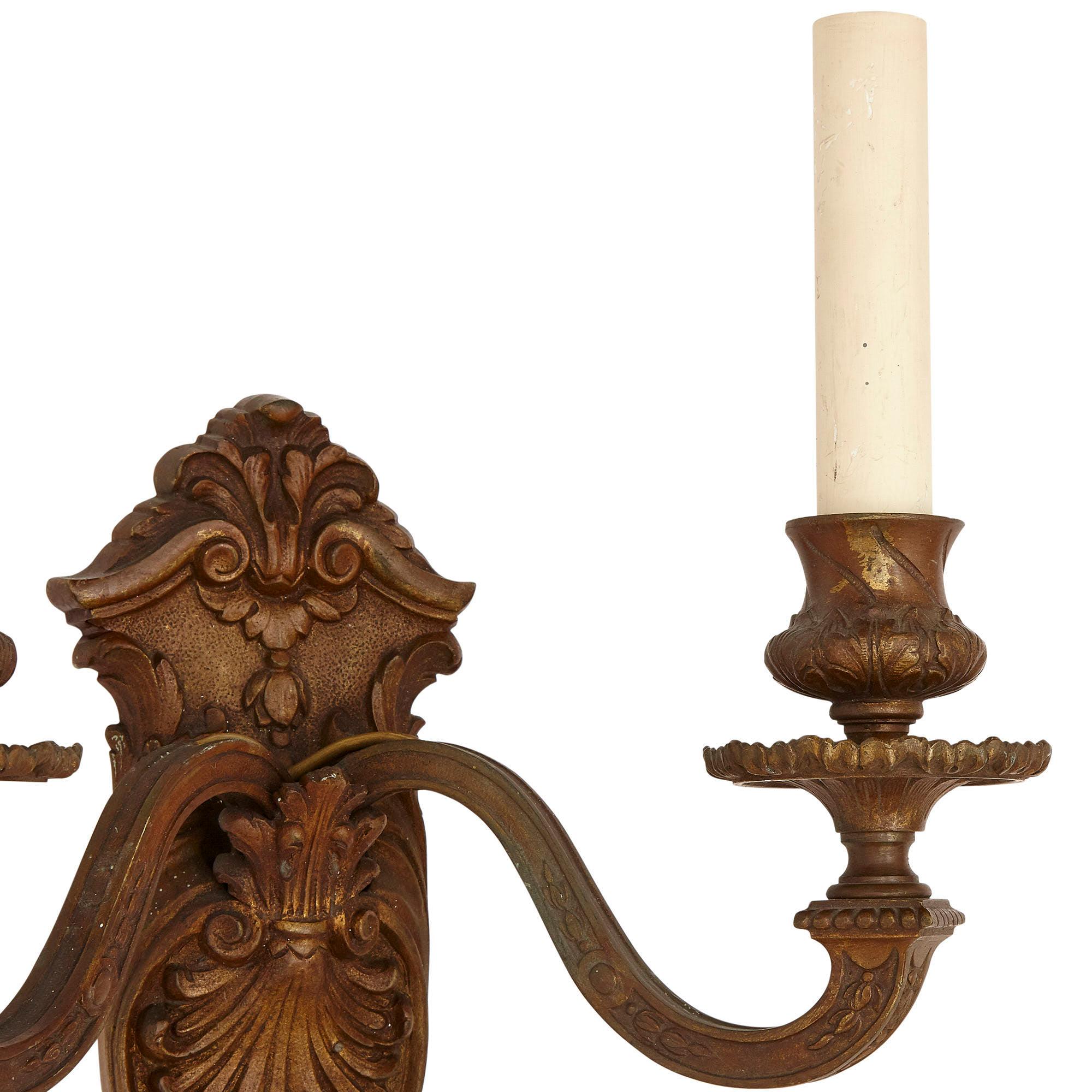 Patinated Pair of Metal Sconces Designed in the Neoclassical Style For Sale