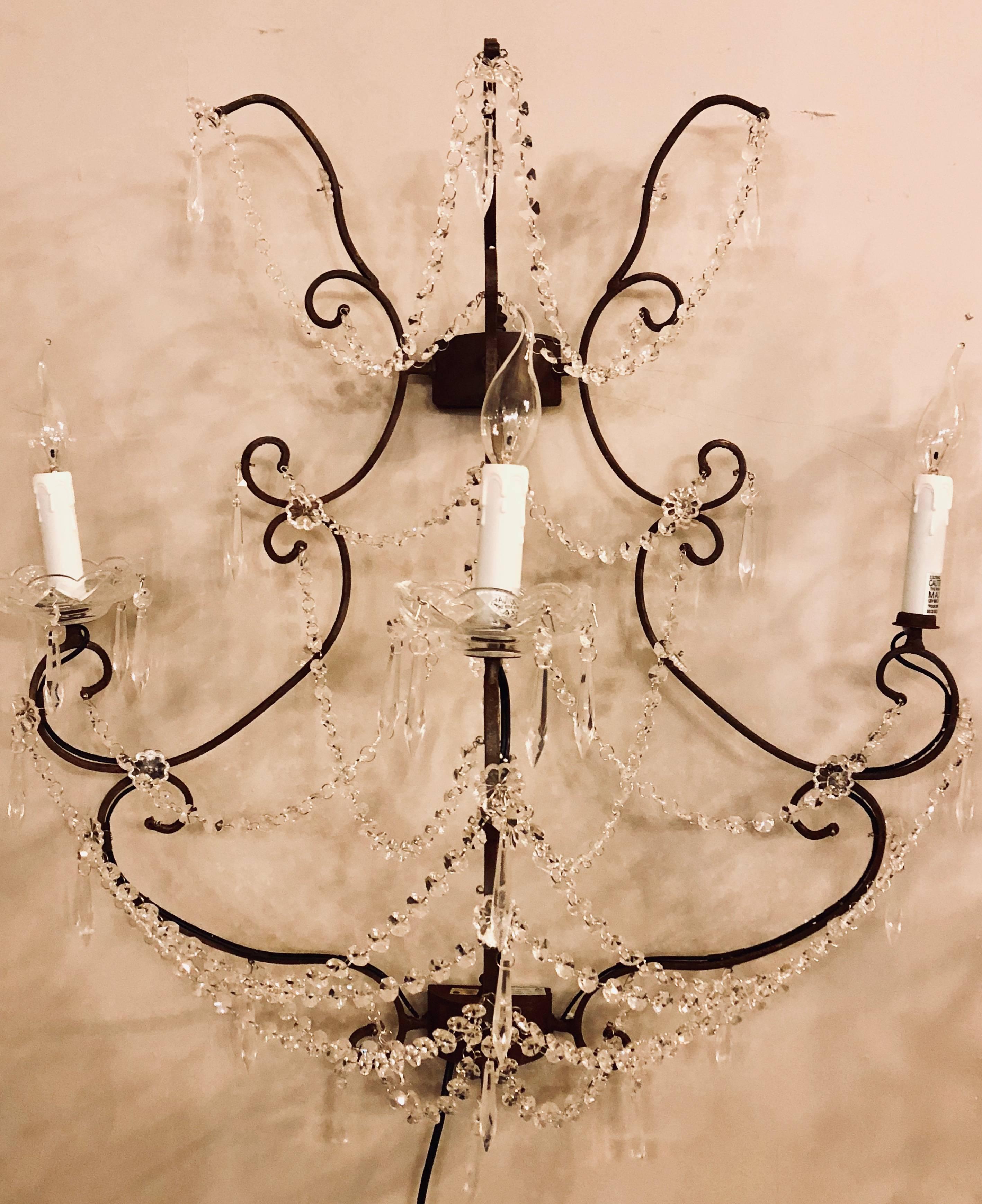 Three pair and one single, Two without  bobeches of metal Timothy Oulton Paris wall sconce of industrial design. One of several pairs available by this highly sought after designer sold at the wholesale level. Part of a large collection of Oulton