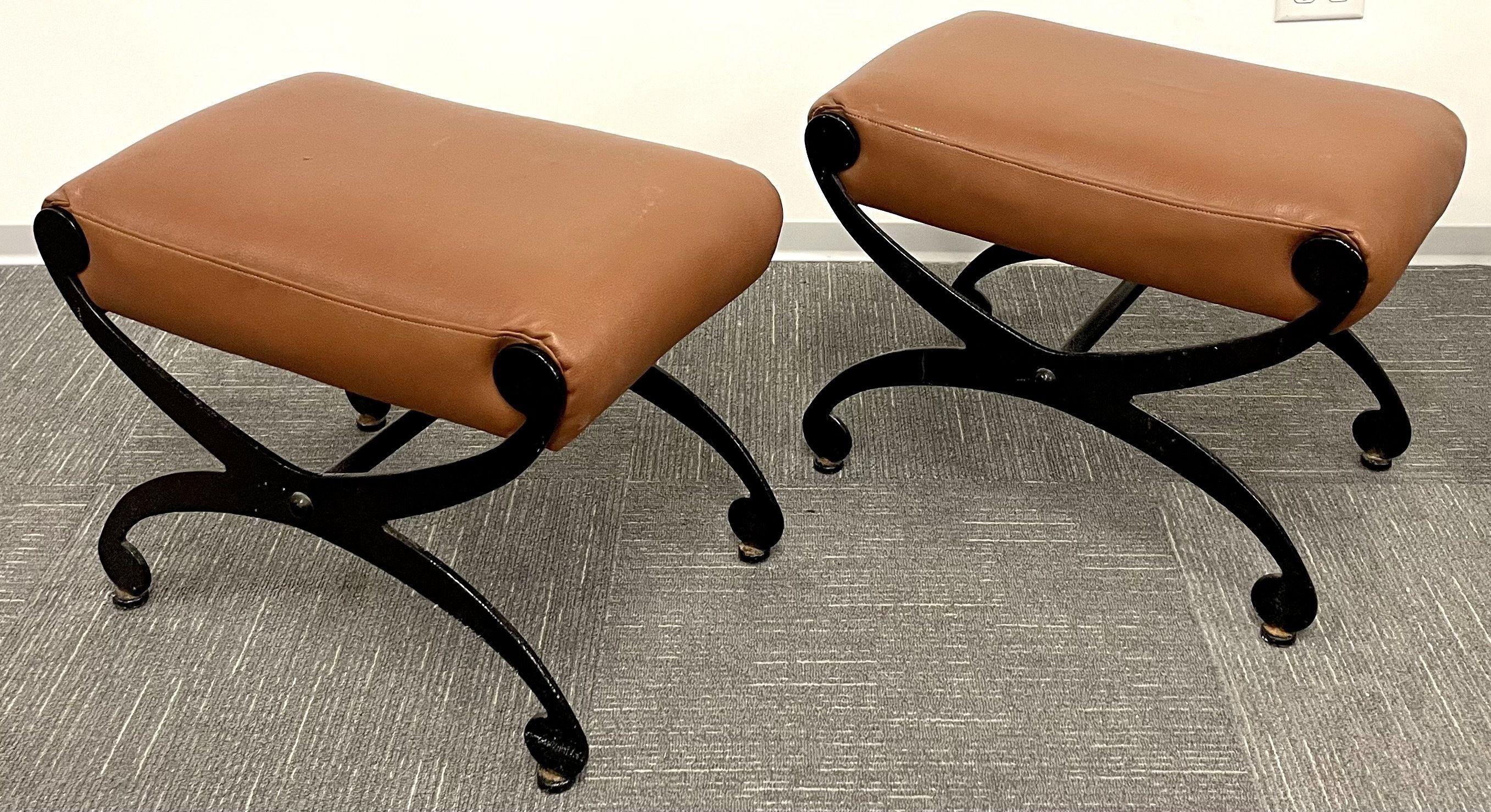 Pair of metal x form benches, footstools, ottomans, leather seats, rustic

A pair of rustic metal x benches in the Mid Century Modern form having leather seat rests. The pair in a Gustavian Style.

Cognac leather, metal
American, 1940s.