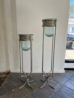 Pair of Mexican Aqua Blown Glass Vessels on Decorative Tole Metal Plant Stands
