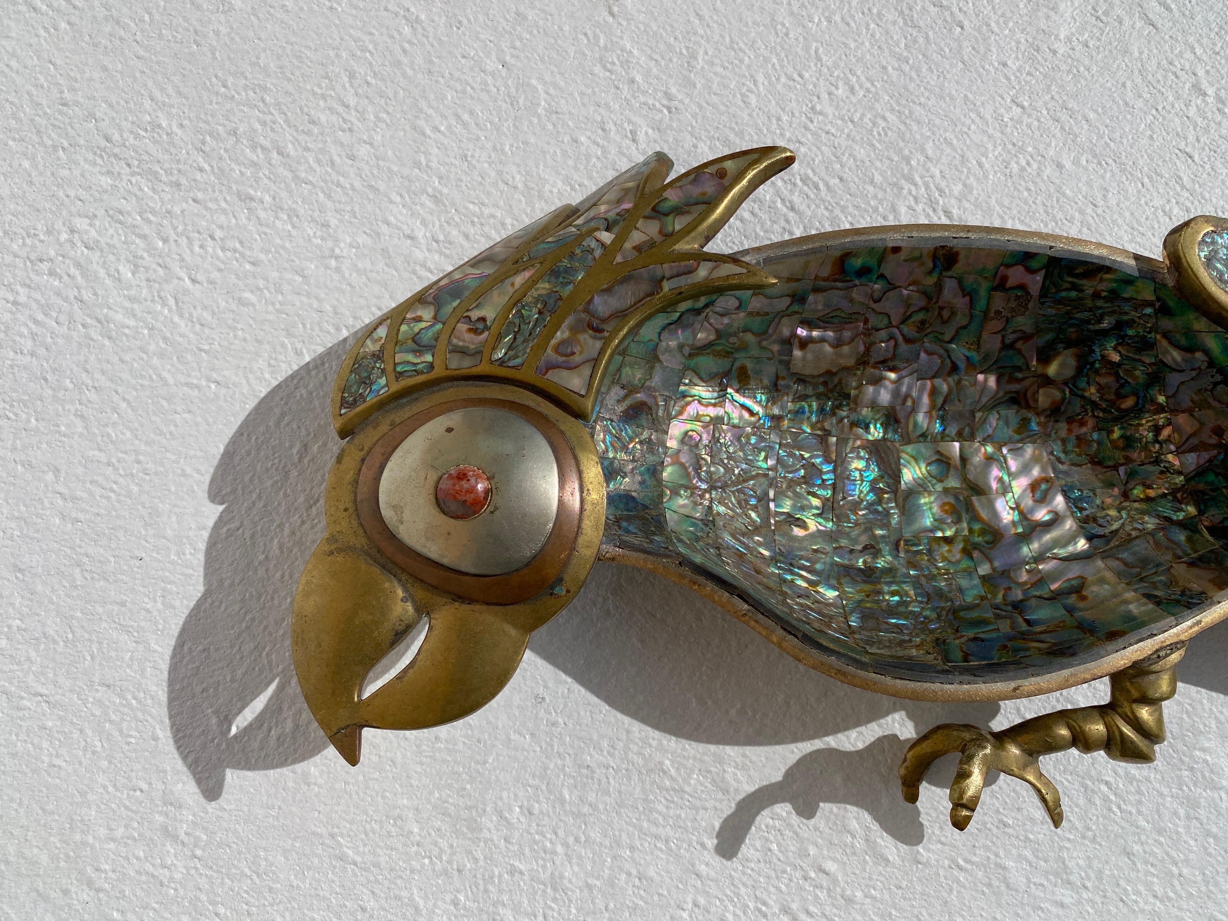 Pair of Mexican brass and abalone shell decorative parrot sculptures attributed to Los Castillo / Emilia Castillo.
Large parrot is 30” long, 9” wide and 3.5” high. Feathers are covered in abalone shell and inside is finished with 22K gold leaf.
