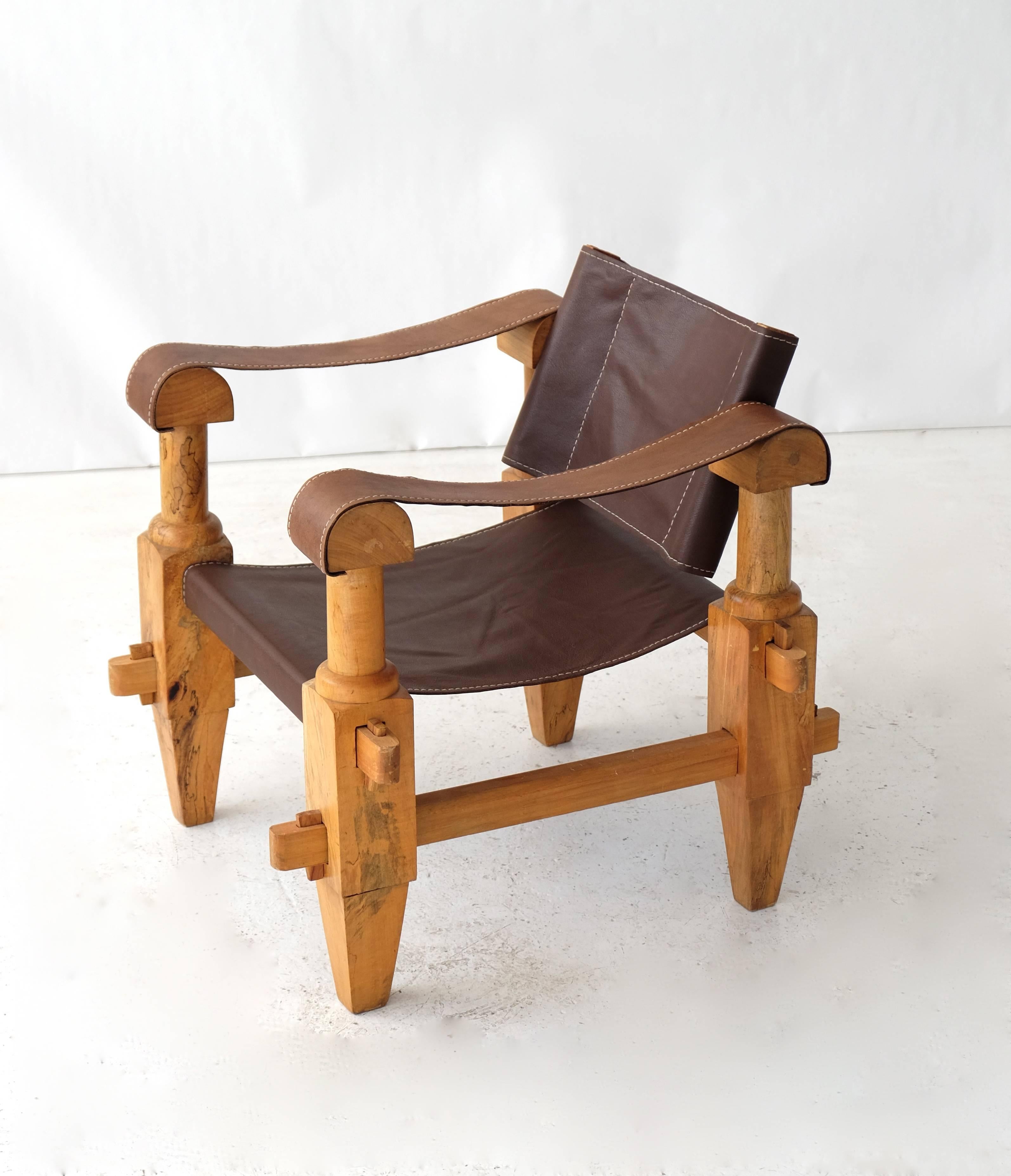 Unique Mexican hand-carved Campaign chairs made of olive wood.
New leather seat and back.