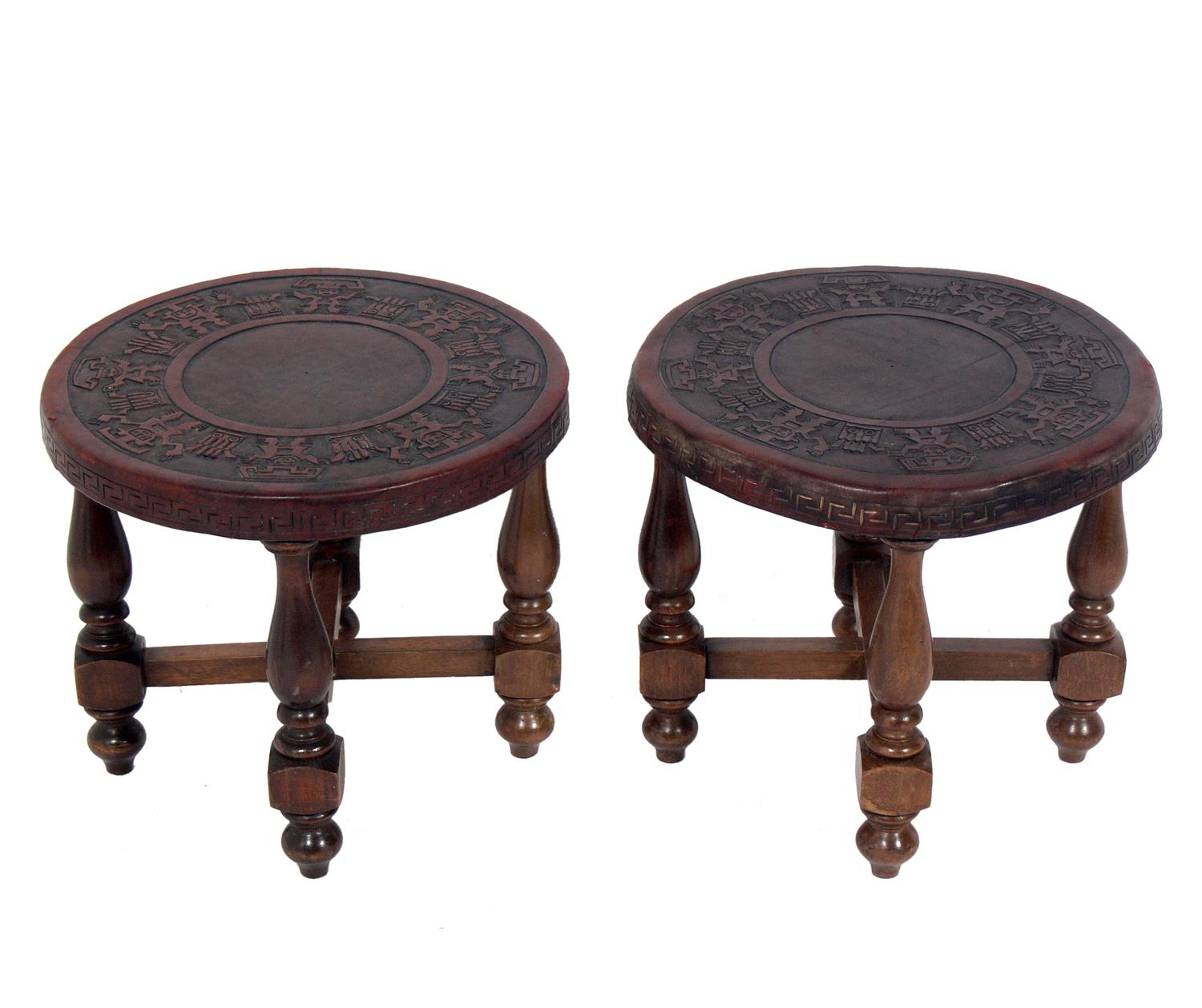 Pair of Mexican embossed leather end tables or stools, Mexican, circa 1940s. They retain their warm original patina. They would be perfect in a California or Mexican hacienda or anywhere you want the organic tribal vibe of aged leather and wood.