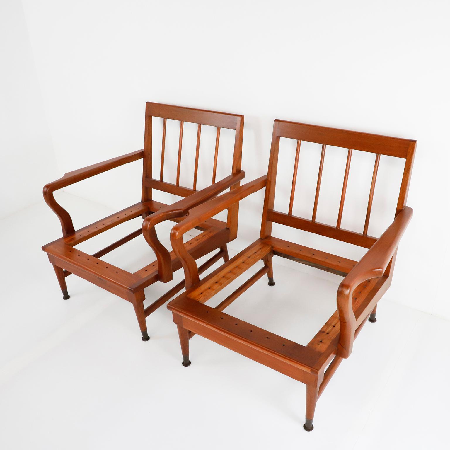 Made in solid mahogany We offer this Pair of Mexican Mid-Century Modern armchairs made in the 1950s. Featuring simple but elegant modern frames. Great vintage condition and recently restored.