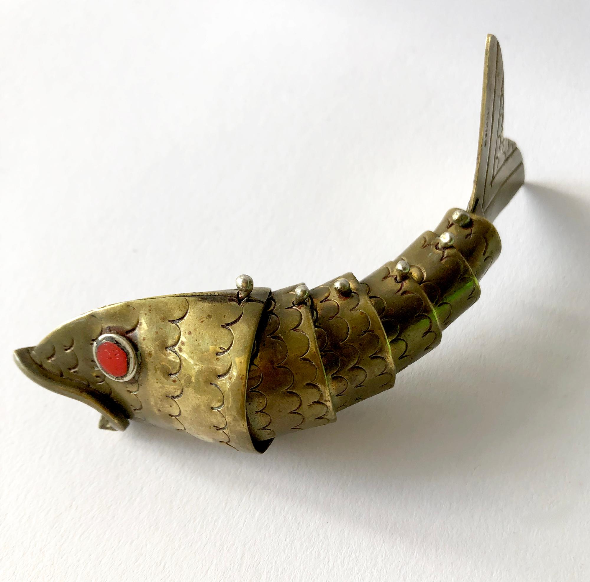 Pair of articulating brass fish with coral eyes from Mexico. Fish measure 4.5