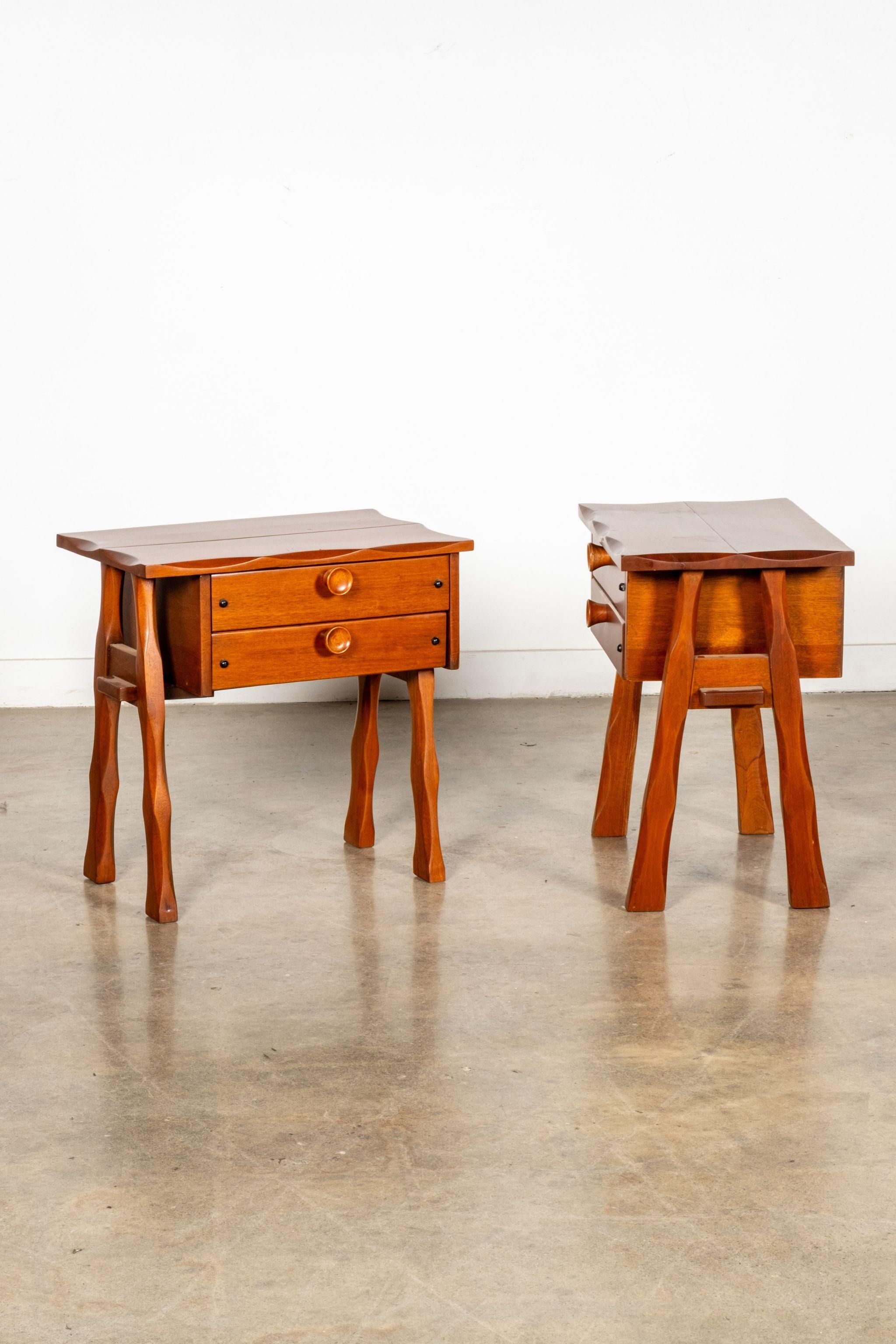 A good nightstand is hard to come by. Harder still, to find a pair that brings charm and personality to a space. This pair, hailing from Mexico in the 1970s, features tall carved legs, large wood pulls and a scalloped wave to its edges. Great