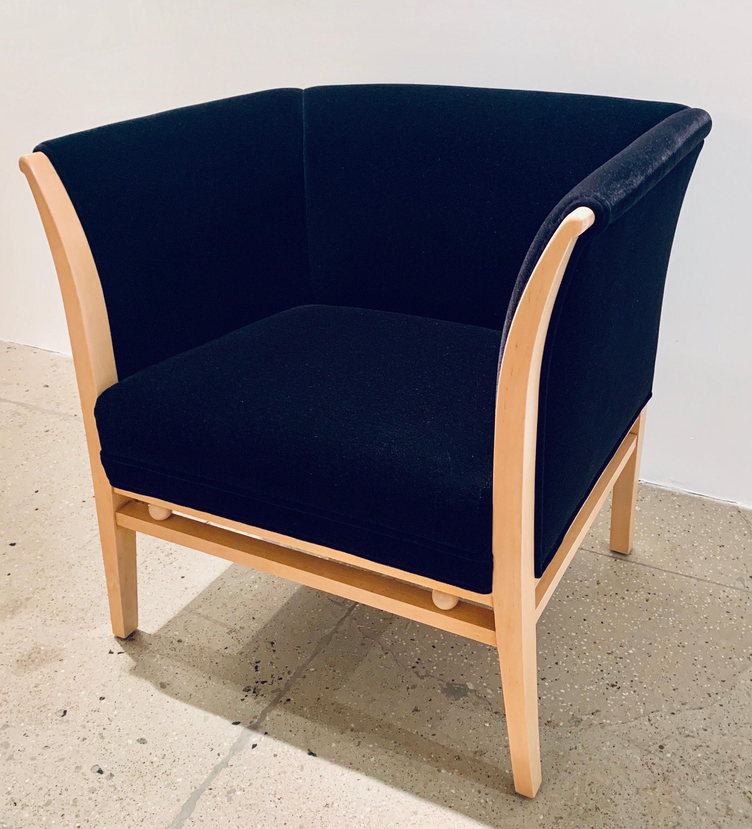 A pair of 1990s Michael Graves for Brayton black shirt mohair upholstery with blond wood club chairs.