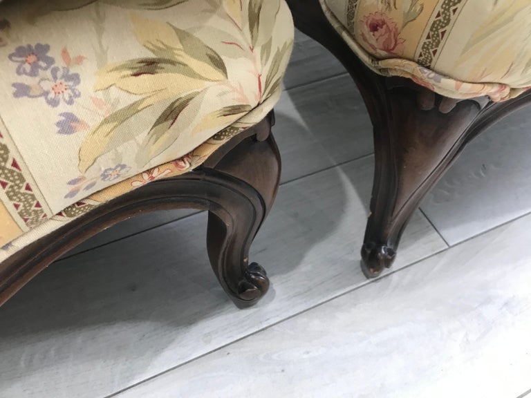This lovely pair of Bergeres are finished in a walnut color. The back cushion is down filled and the quality is quite nice overall. They are oversized and comfortable. The fabric is in very good condition. 
