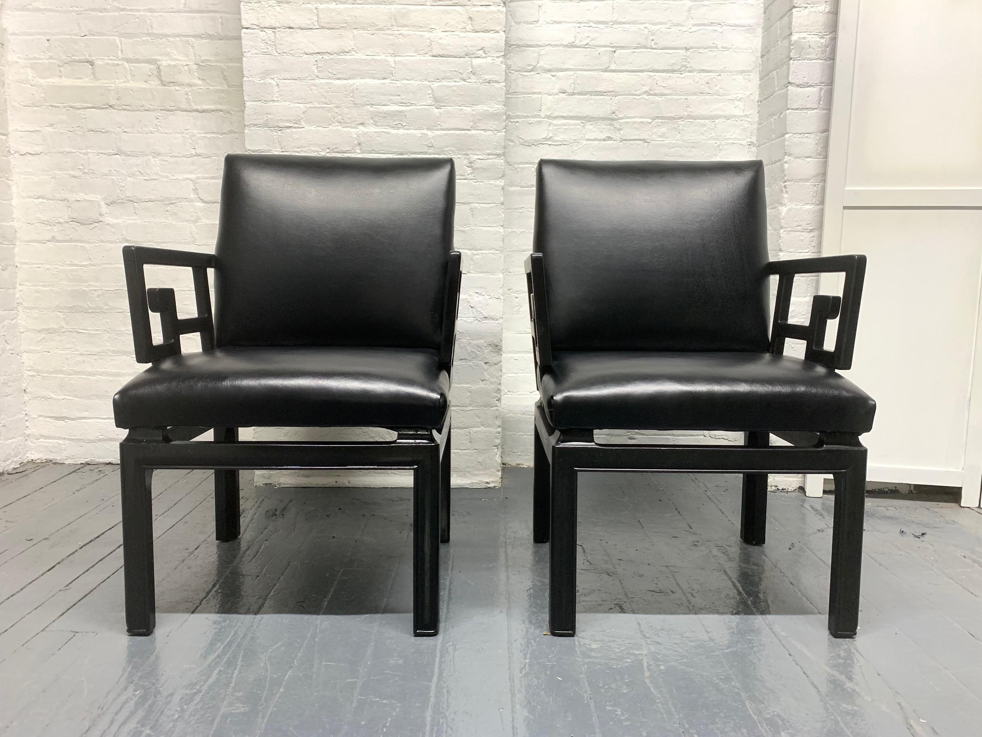 Pair of Michael Taylor for Baker Asian style chairs. The chairs have black lacquered solid wooden frames with black vinyl cushioned seats. Chairs are sturdy.
Measures: 35 H x 23.25 W x 25 D.
Seat height 18.5, arm height 26 H.