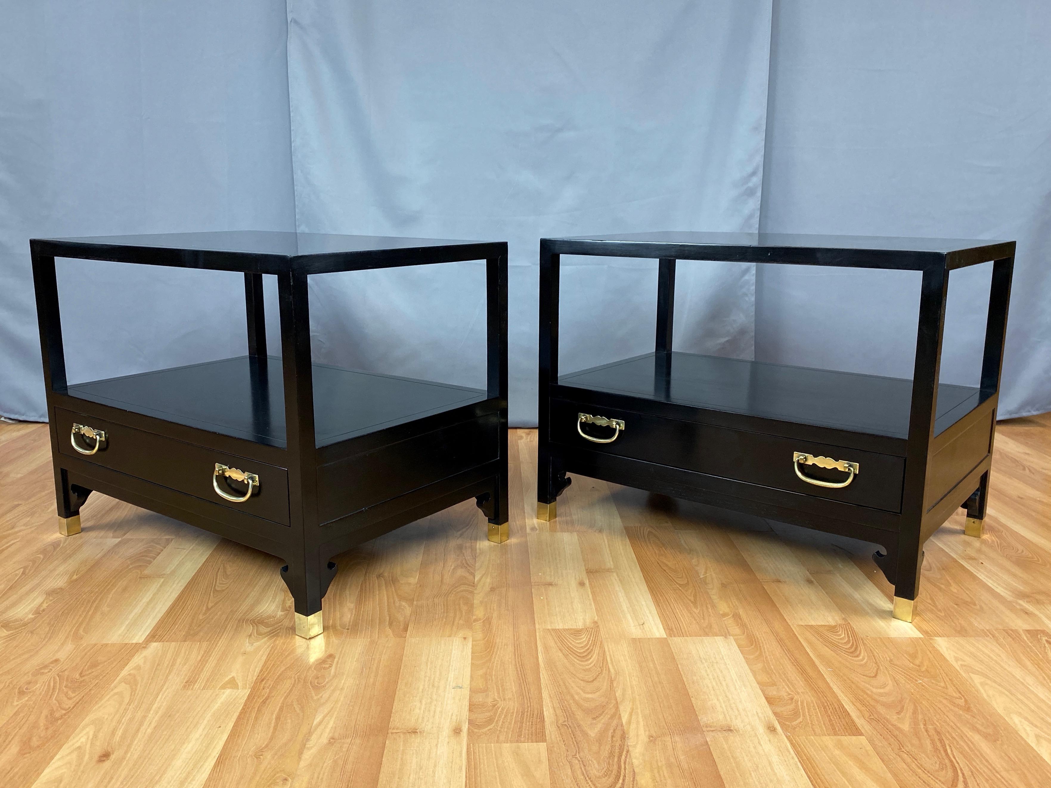 A pair of uncommon and chic Hollywood Regency side or end tables with drawers by Michael Taylor for Baker Furniture.

Solid walnut with satin black lacquer finish. Single drawer with a pair of brass pulls that's accented by handsome flush-fit