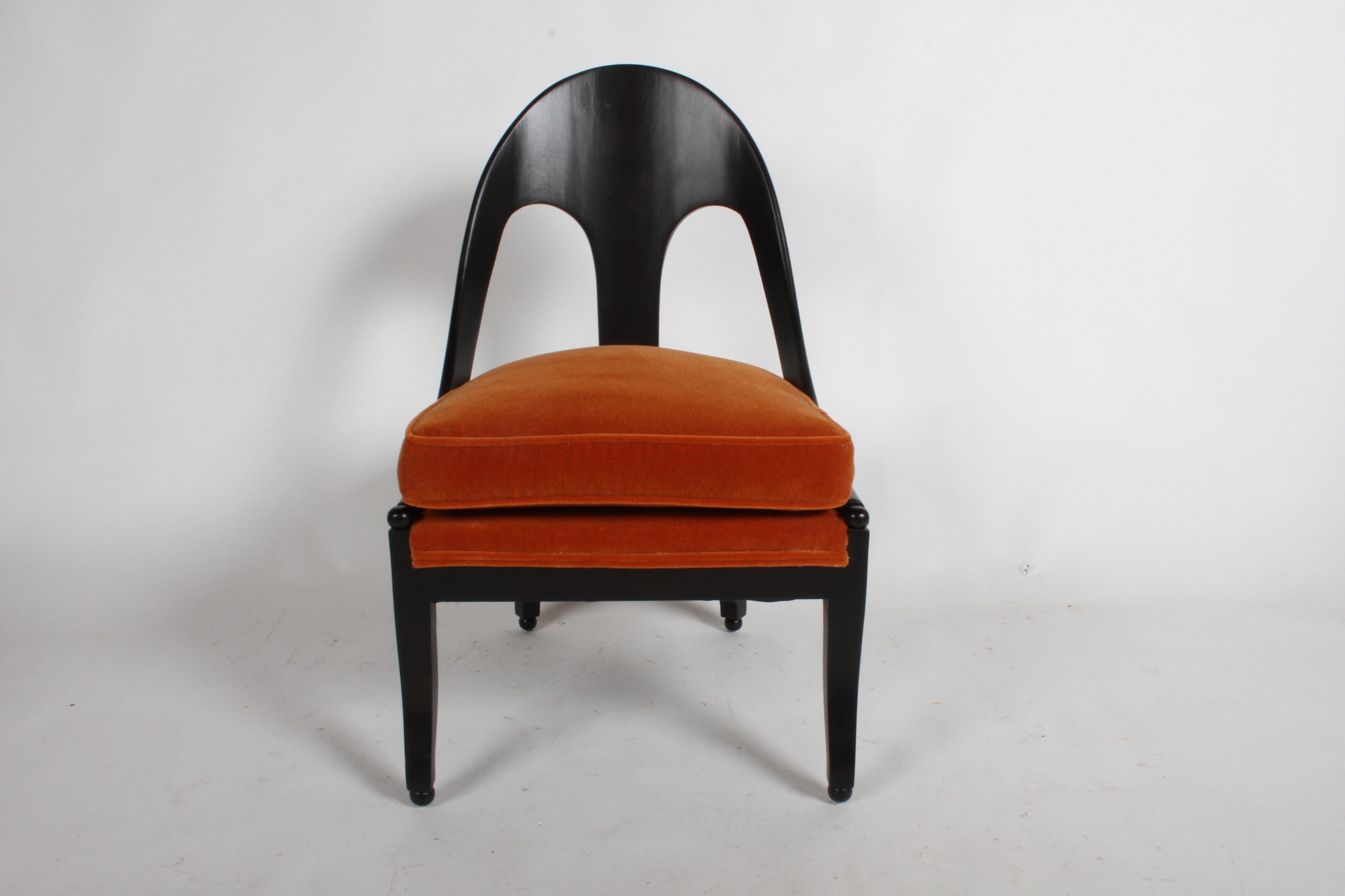Michael Taylor pair of classic spoonback neoclassical lounge chairs. Refinished in an ebony stain and burnt orange mohair. Only one chair has been reupholstered, might not have enough mohair for second chair. No label. 

     
