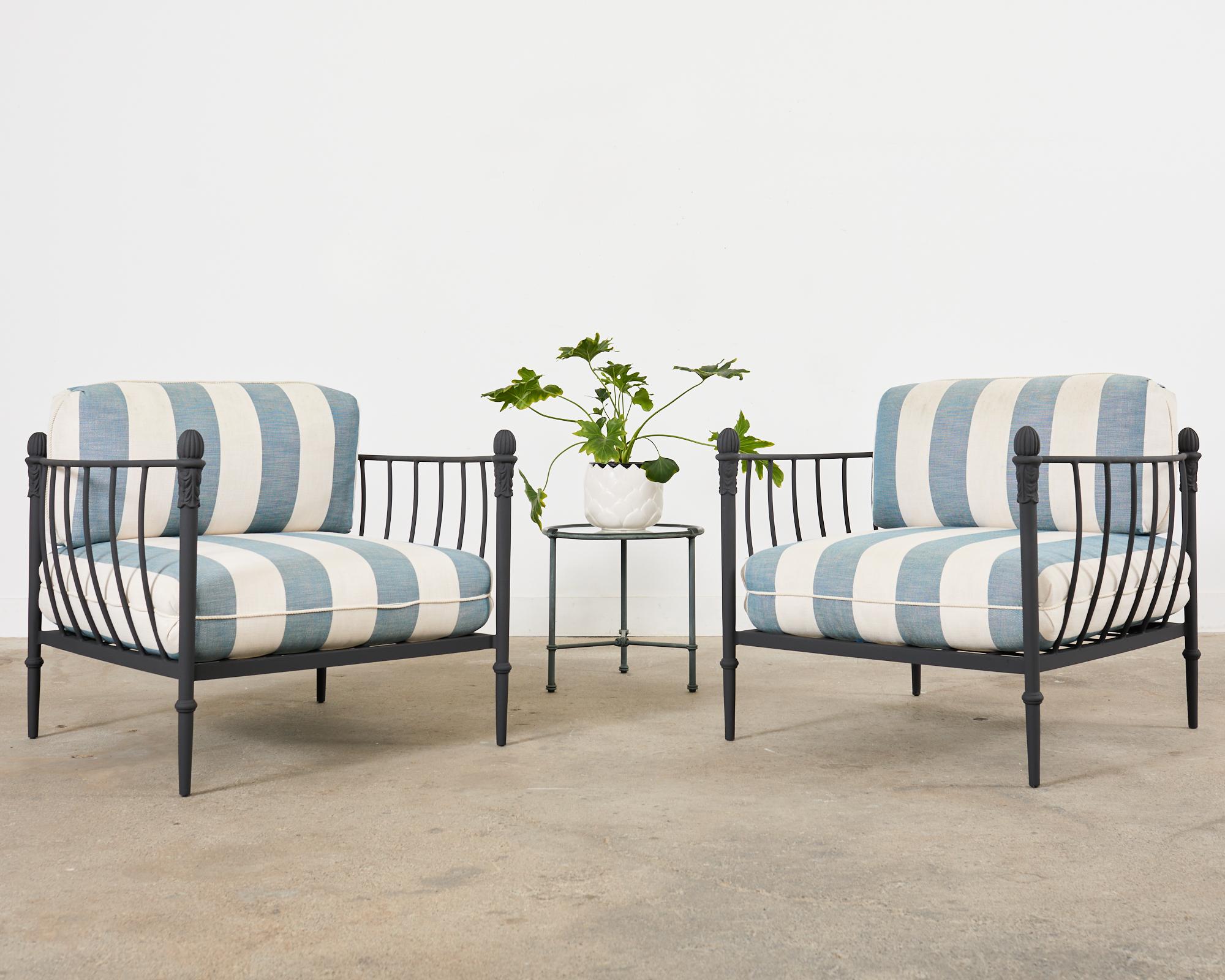 Iconic pair of patio and garden cast aluminum chairs and ottoman made in the style and manner of Michael Taylor by a foundry in Los Angeles, CA. The Montecito chairs feature an oversized frame with large fitted cushions in a blue and white striped