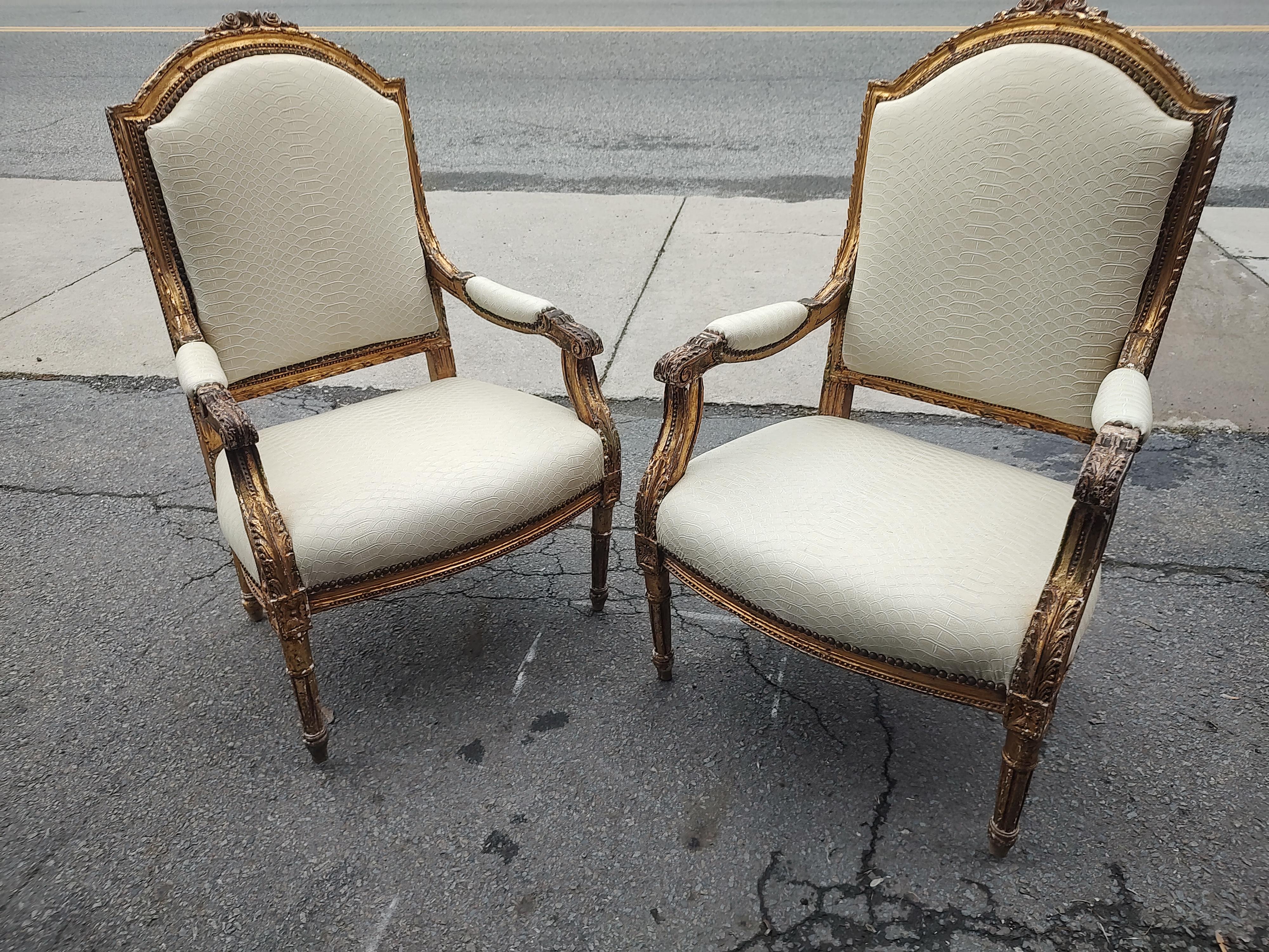 Fabulous pair of Mid 18th Century Gilt French Sculptural Armchairs in faux crocodile and cotton velvet. Hand carved, Gilt and in very good condition considering their age. Updated in a faux crocodile upholstery brings into the 21st century with cool