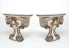 Pair of 18th Century Italian Polychrome and Gilt Limewood Consoles with Cherubs