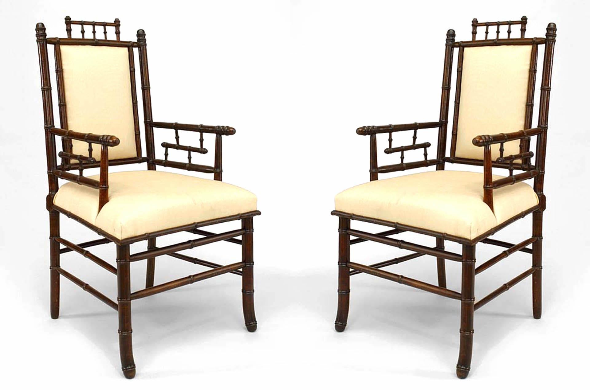 Pair of French Victorian faux bamboo stained walnut armchairs with lattice design sides and beige upholstered seats and back panels (PRICED AS Pair)

