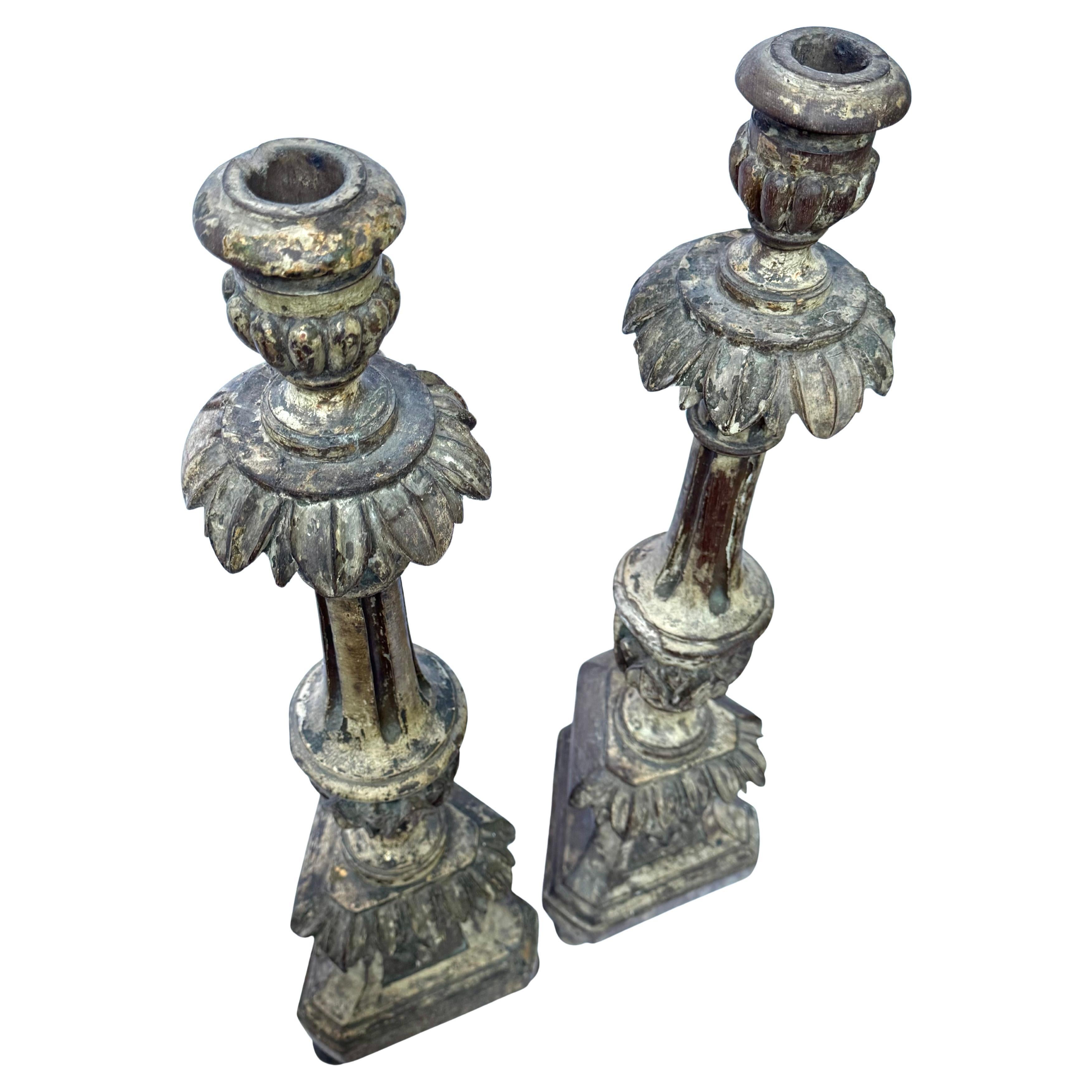 Pair of Mid-19th Century Baroque Revival Carved Wooden Candlesticks – Traces of Original Polychrome 
 An evocative and sculptural pair of tall altar candlesticks, hand-carved in wood and dating from the mid-19th century. Likely originating from