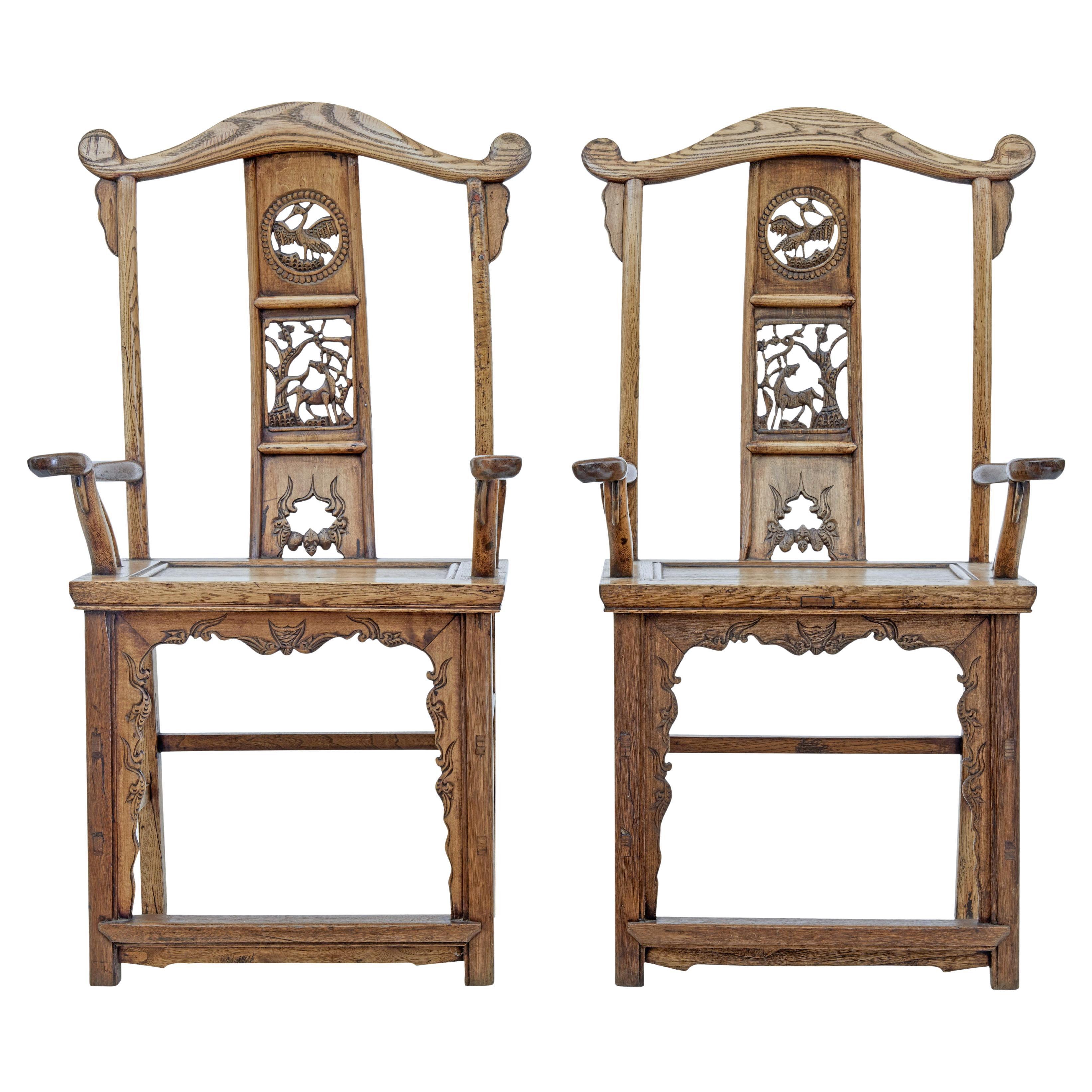 Pair of mid 19th century carved elm Chinese yoke back armchairs For Sale