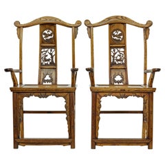 Pair of mid 19th century carved elm Chinese yoke back armchairs