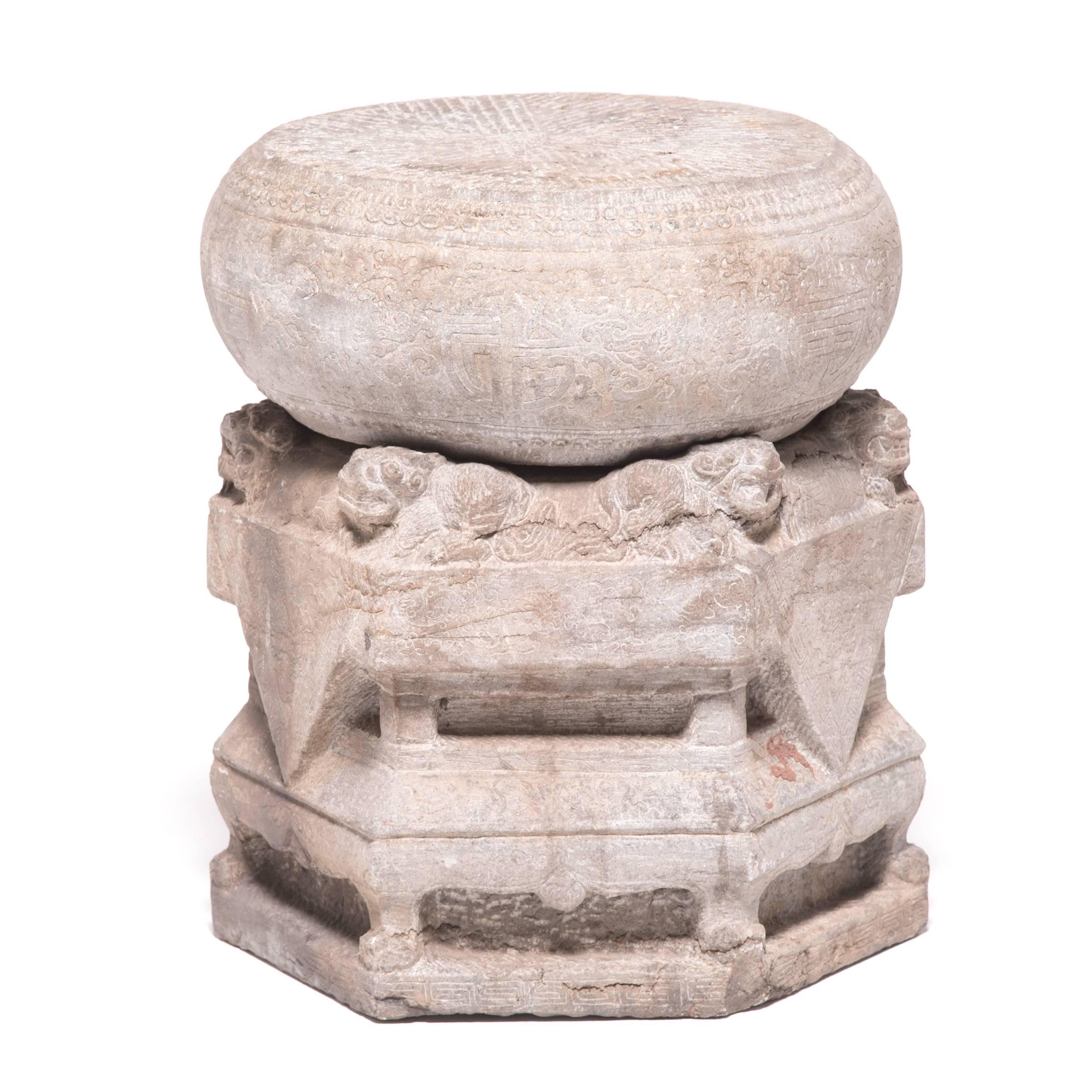These 19th century column supports likely figured into the grand and imposing surroundings of a Qing-dynasty courtyard, flanking the entryway with its protective presence. Carved from limestone, the columns are composed of two sections: a