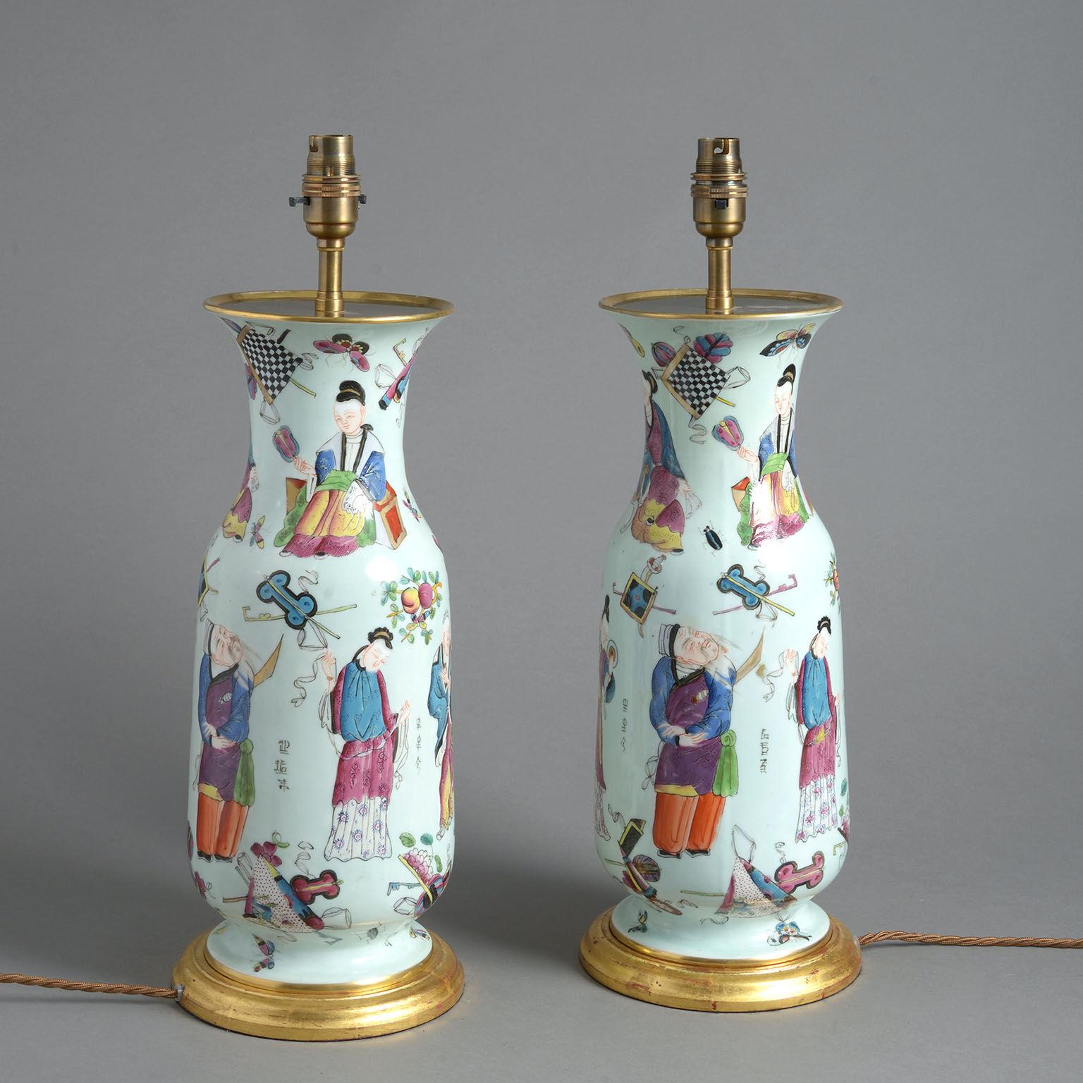 A pair of mid-19th century Chinoiserie Bayeux porcelain vases as lamps, the baluster shape decorated with all over chinoiserie figures on an ice-blue ground. Now converted as lamps.