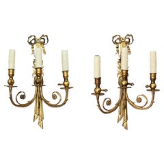 Coppia di lampade a tre luci in bronzo dorato francese della metà del XIX secolo