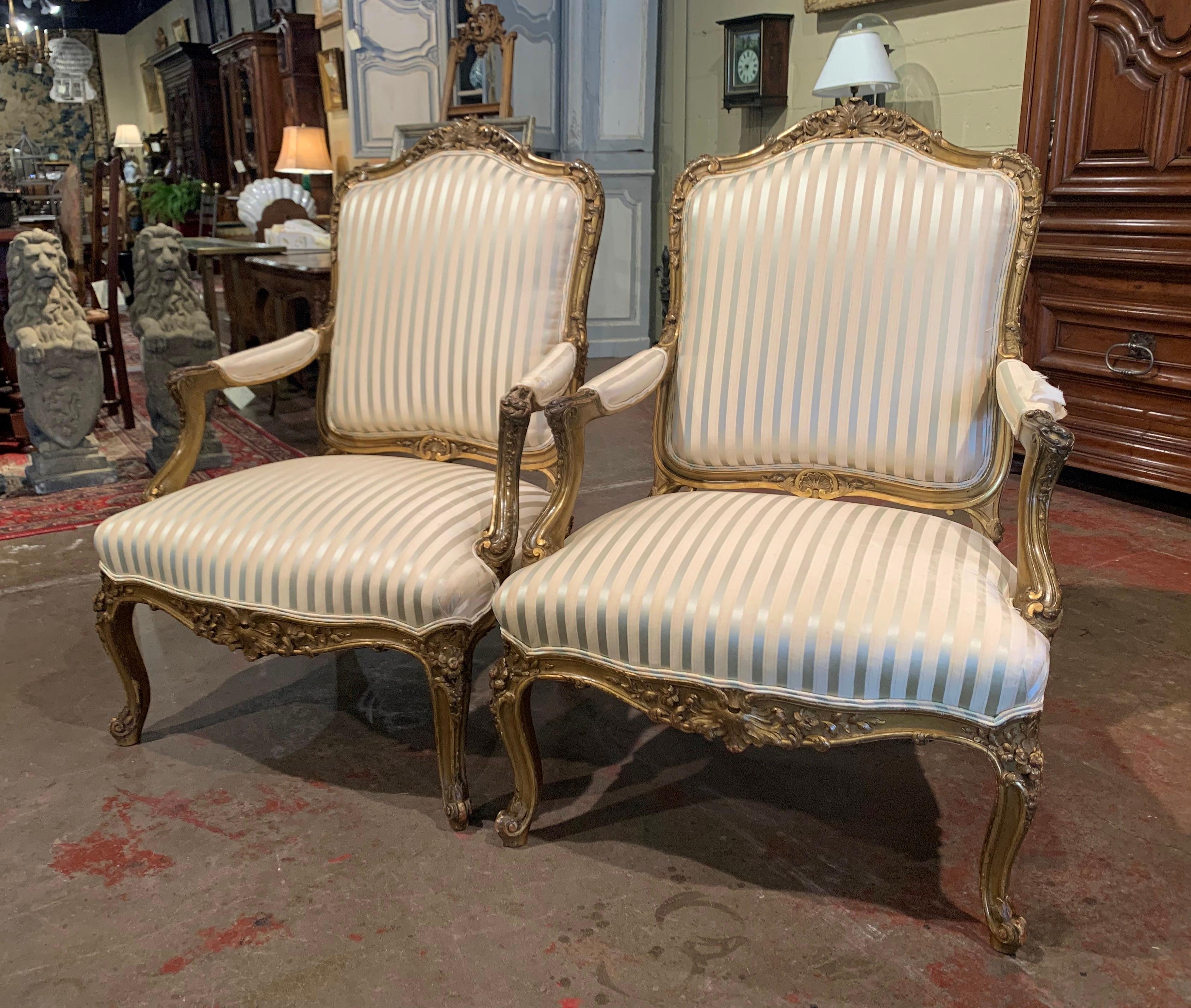 Hand-Carved Pair of Mid-19th Century French Louis XV Carved Giltwood Bergères Fauteuils