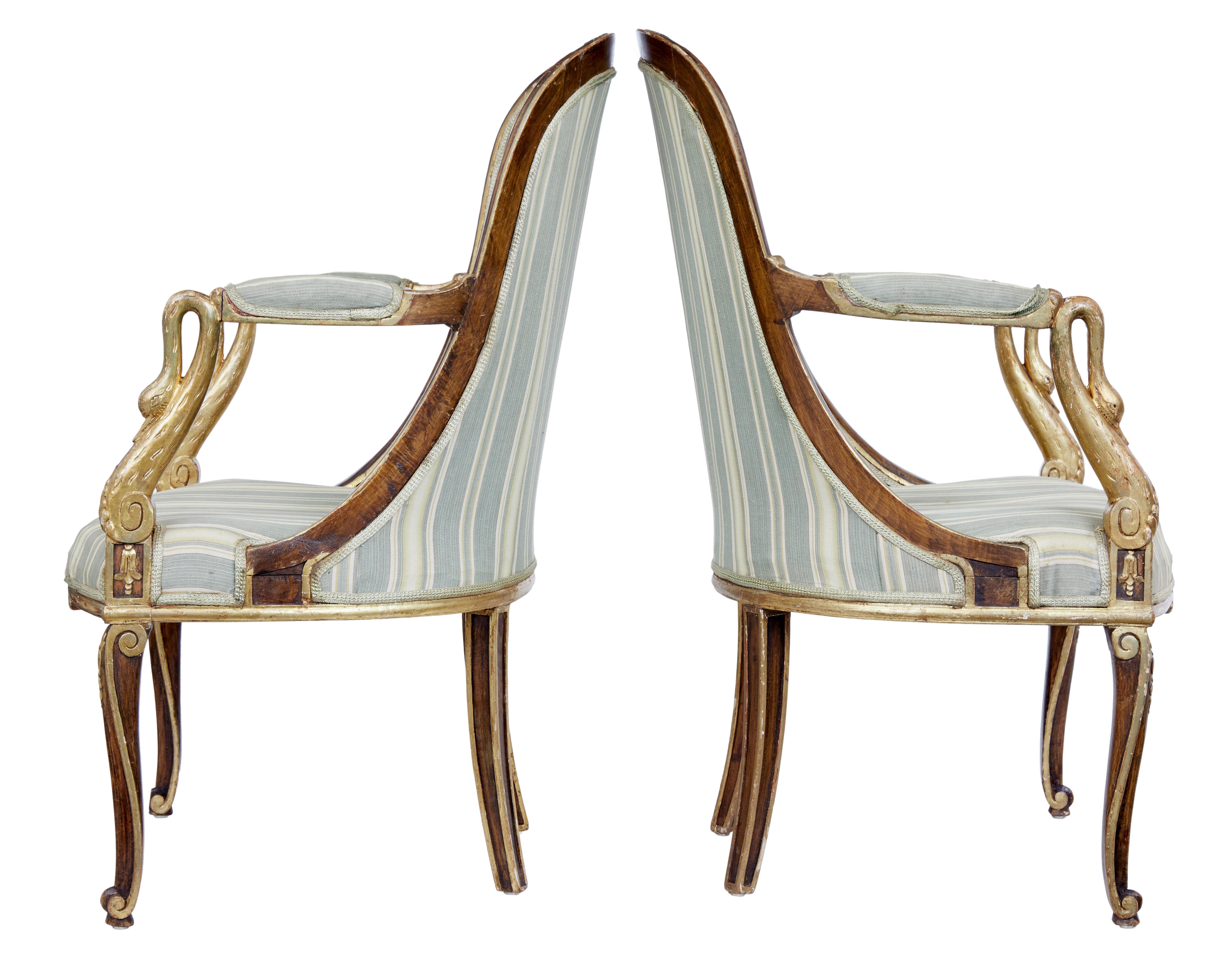 Pair of mid-19th century French walnut and gilt armchairs, circa 1840.

Fine and rare pair of French walnut armchairs. Shaped backs which leads down the arms which are supported by carved gilt swan necks. Further gilt and scroll work to the