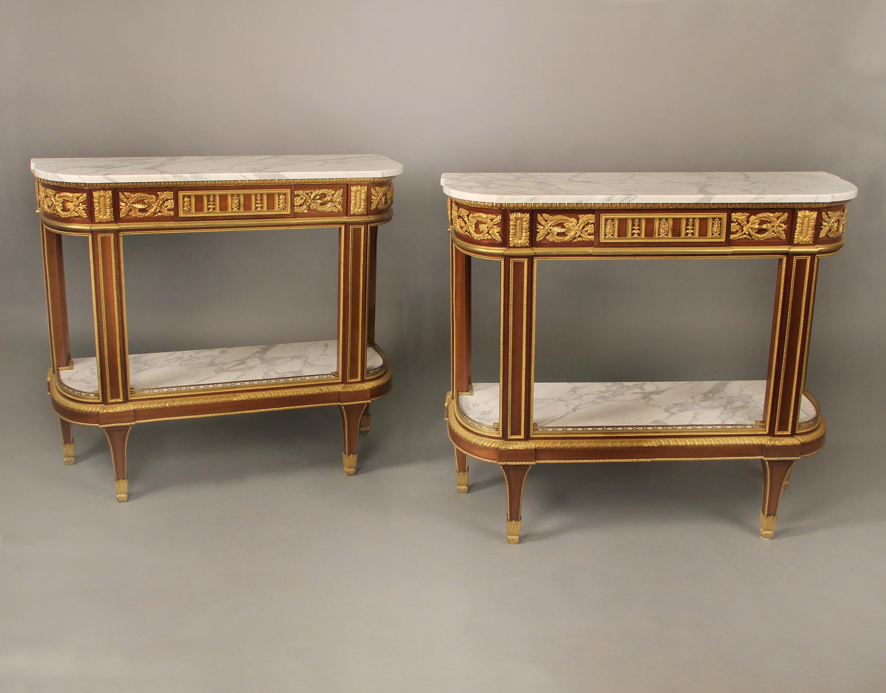 An excellent quality pair of mid 19th century gilt bronze mounted Louis XVI style console / dessert tables attributed to Winckelsen

Attributed to Charles-Guillaume Winckelsen

The demilune Carrara marble tops above a long single drawer centered