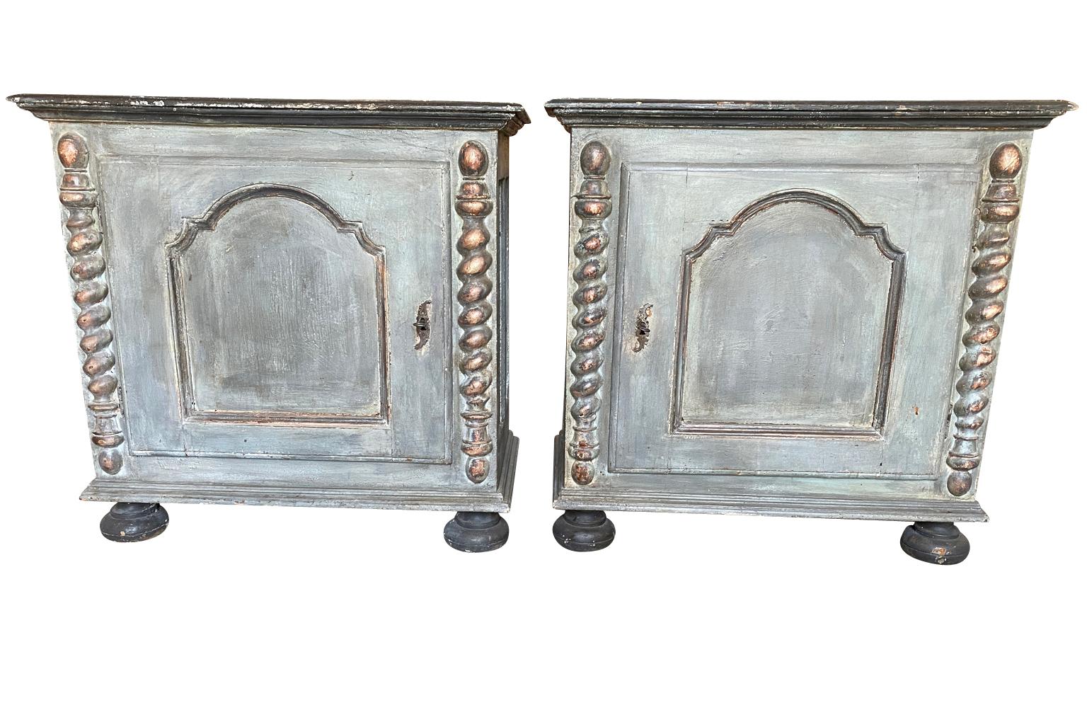 A delightful pair of mid-19th century buffets from the Genoa region of Italy. Wonderfully constructed from painted wood with a single door raised on bun feet.