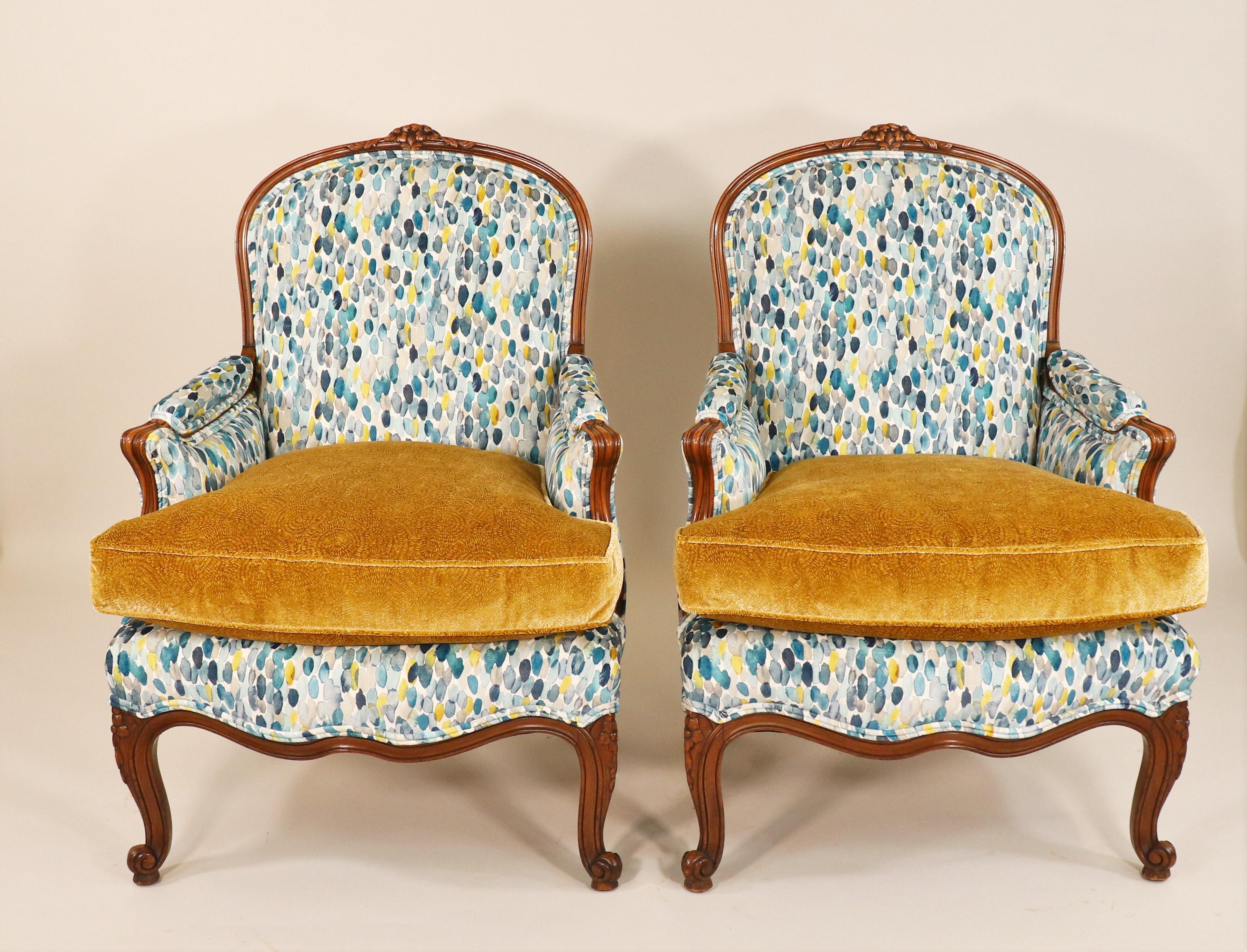 This is an exquisite pair of French mid-19th century Louis XV Style Bergère armchairs. The style was a direct response to the previous Louis XIV style, which valued furniture that emanated power and masculinity. Louis XV-style furniture was daintier