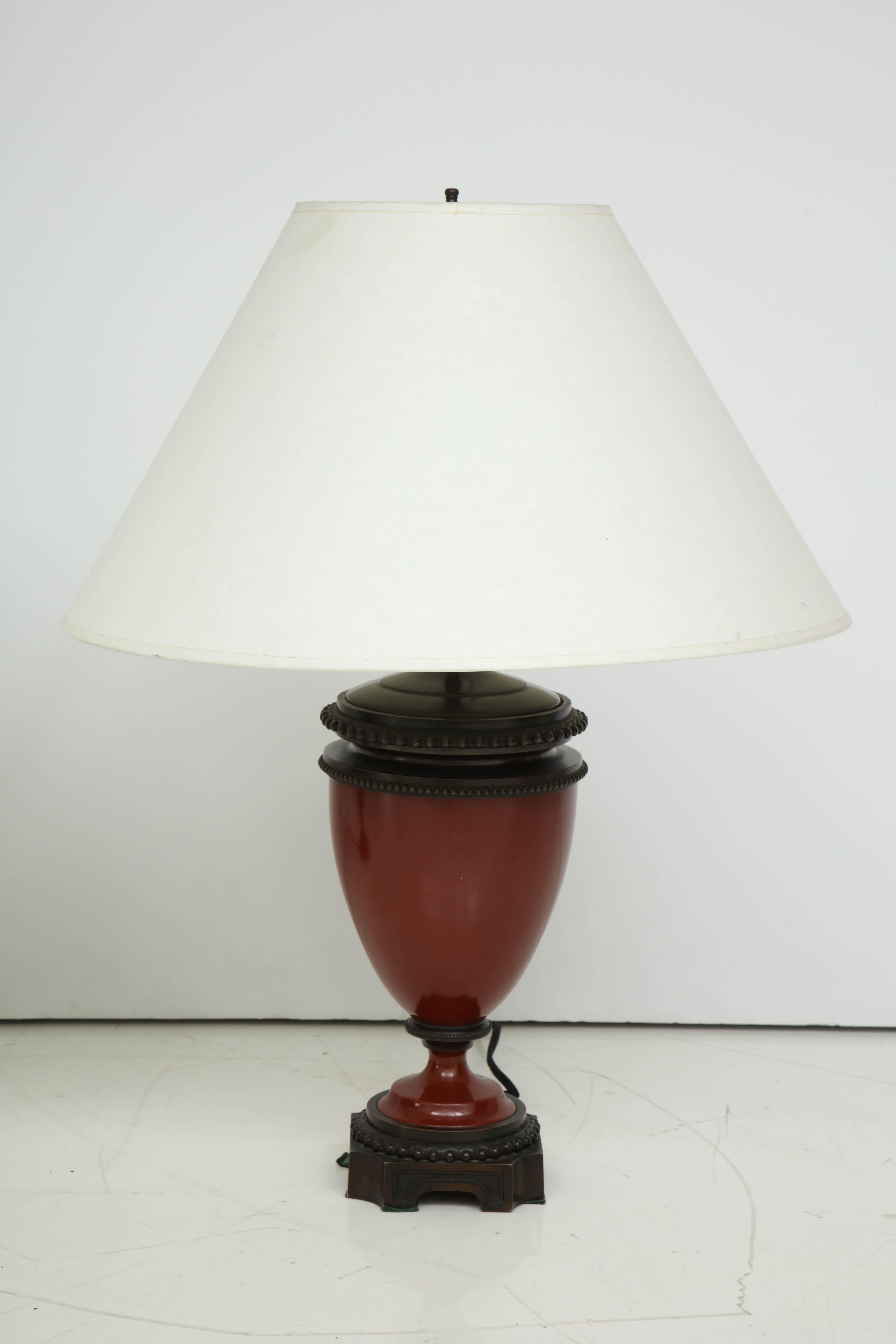 Pair of mid-19th century red porcelain and patinated bronze vase shaped lamps.