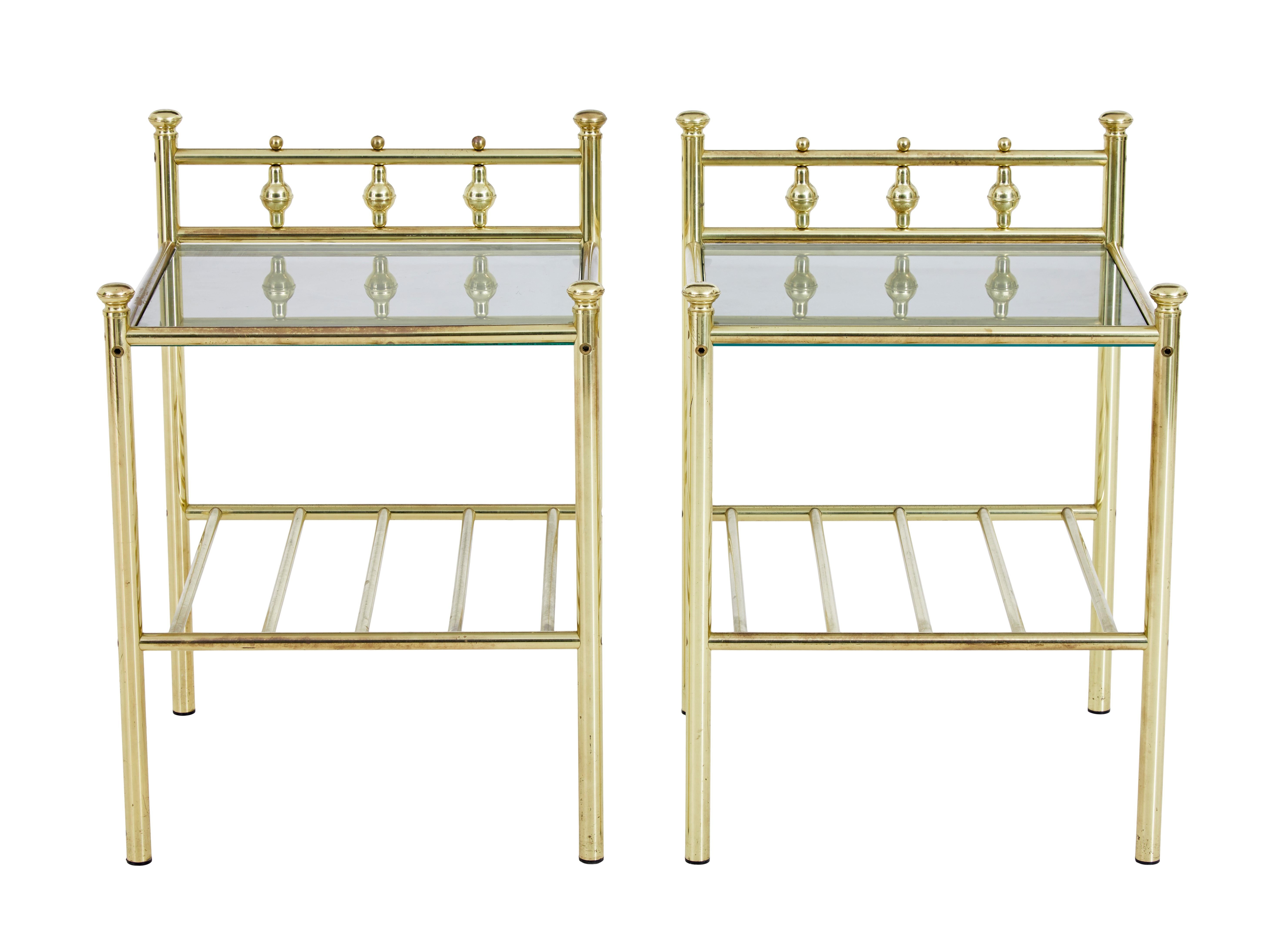 Pair of mid 20th century brass glass top occasional tables circa 1970.

Pair of useful brass lamp / side tables, which echo the design of Victorian brass beds with modern elements.  Tubular brass construction, with smoked toughened glass insert tops