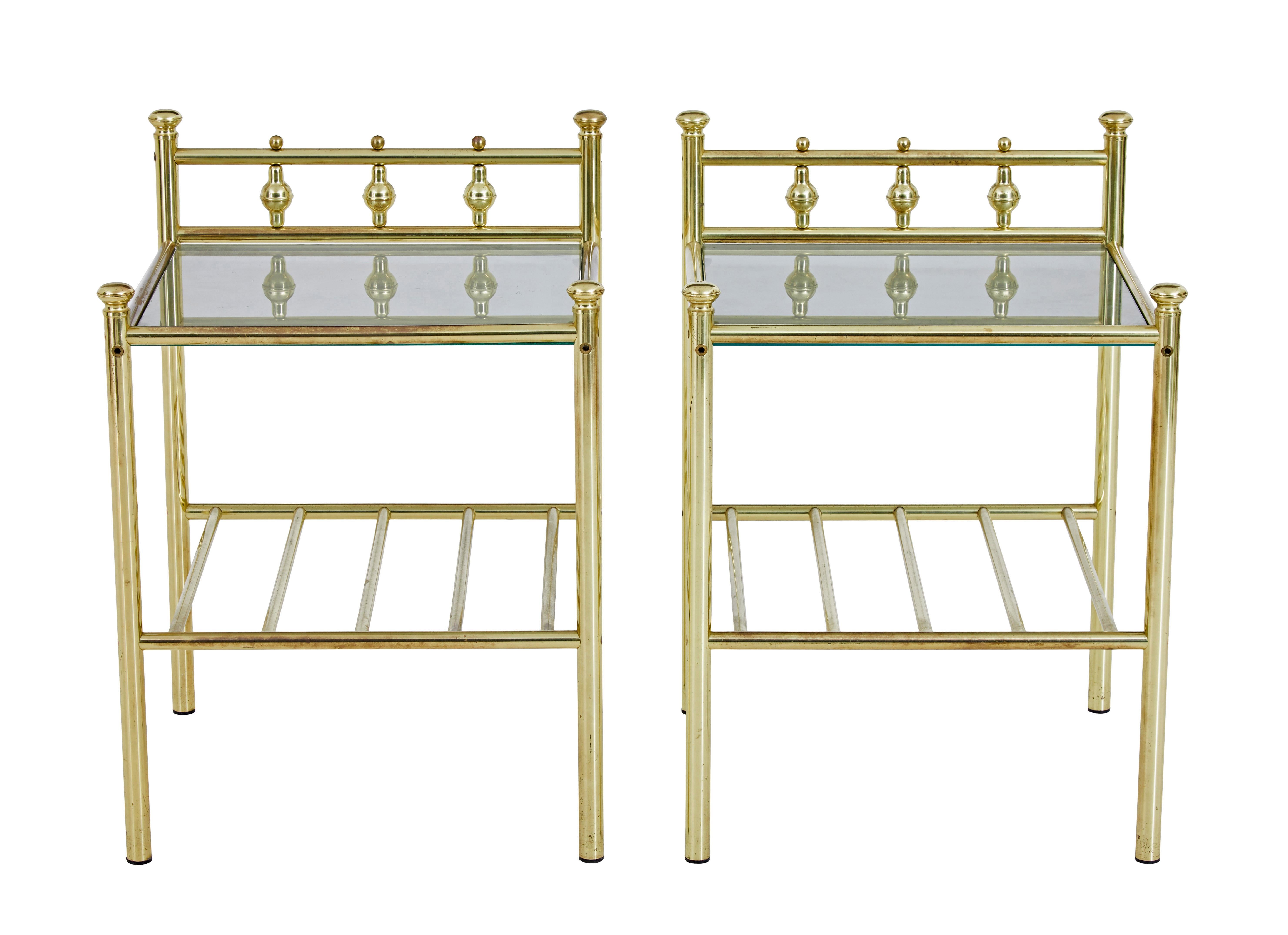 Pair of mid 20th century brass glass top occasional tables circa 1970.

Pair of useful brass lamp / side tables, which echo the design of victorian brass beds with modern elements.  Tubular brass construction, with smoked toughened glass insert tops