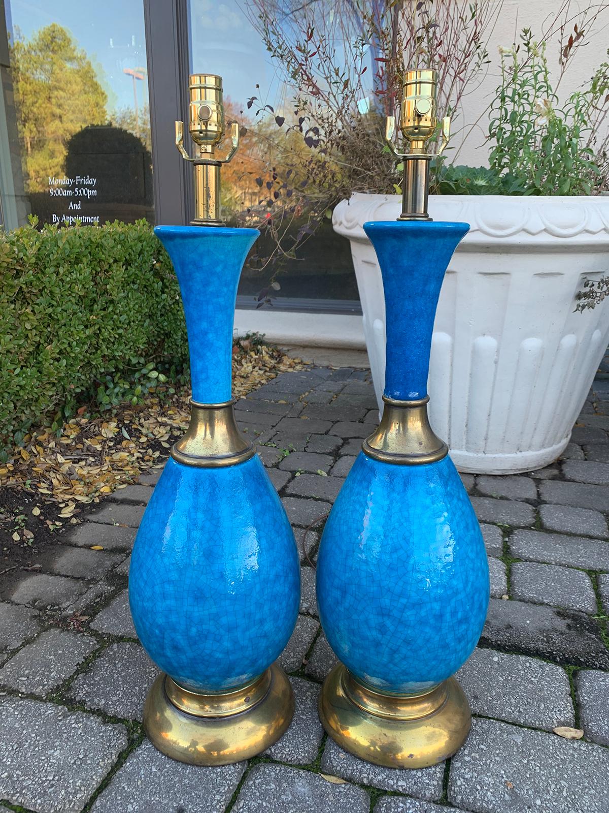 Pair of mid-20th century brass-mounted blue pottery lamps
Brand new wiring.