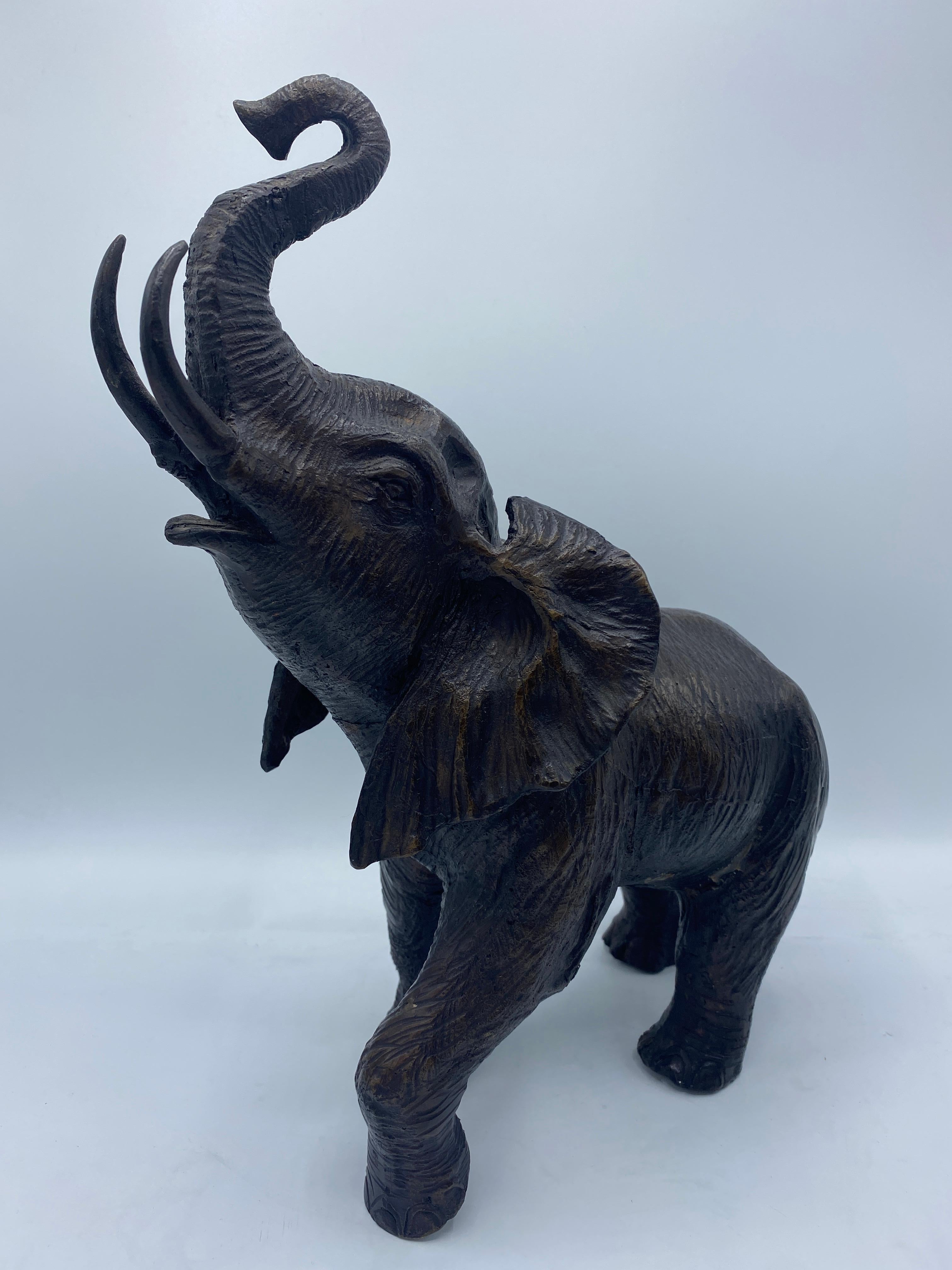 Pair of mid-century bronze elephant sculptures
1940s - 1960s 
Measure: 13