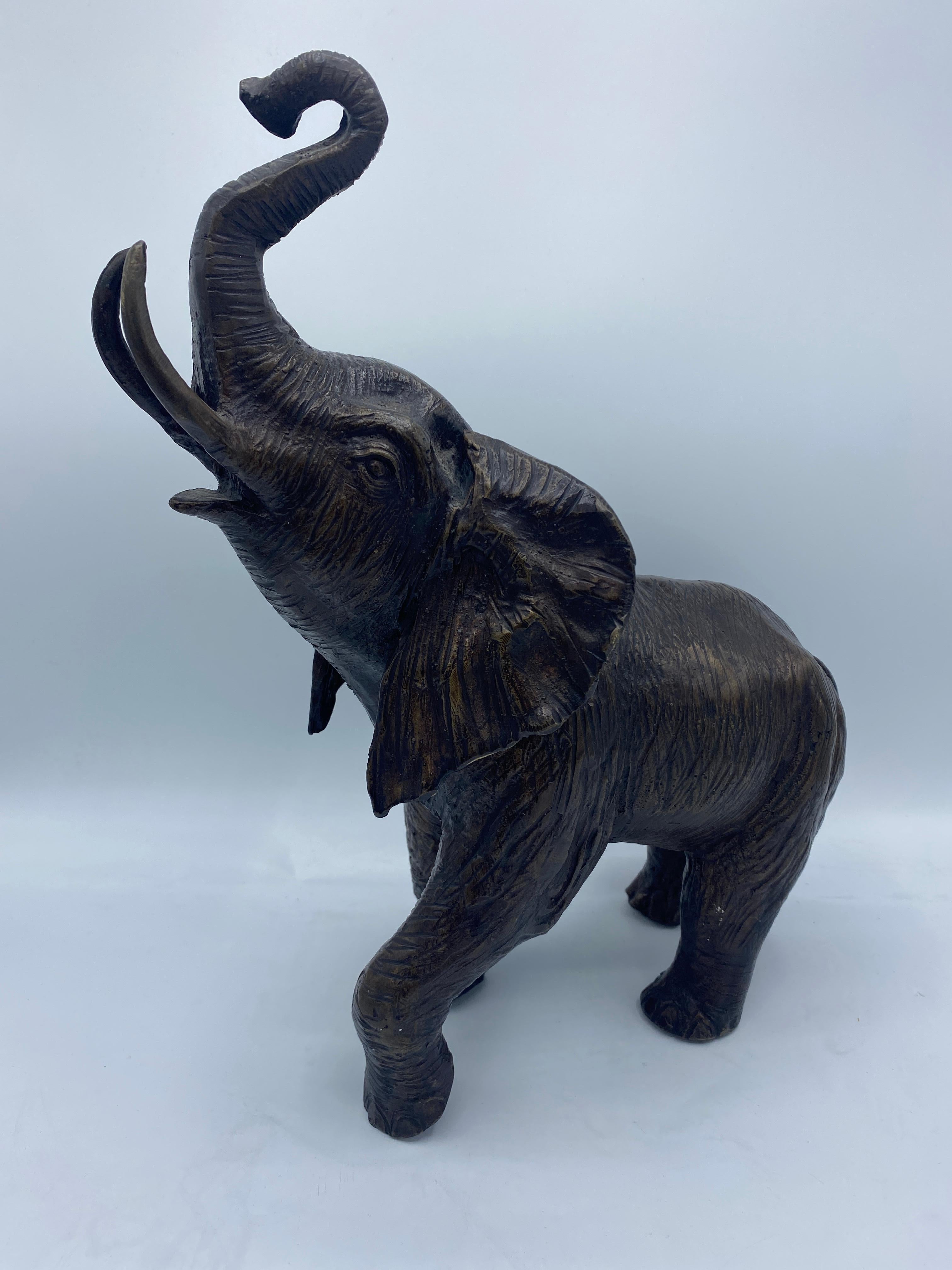 Pair of Mid-20th Century Bronze Sculptures of Elephants with Raised Trunks In Good Condition For Sale In Middleburg, VA