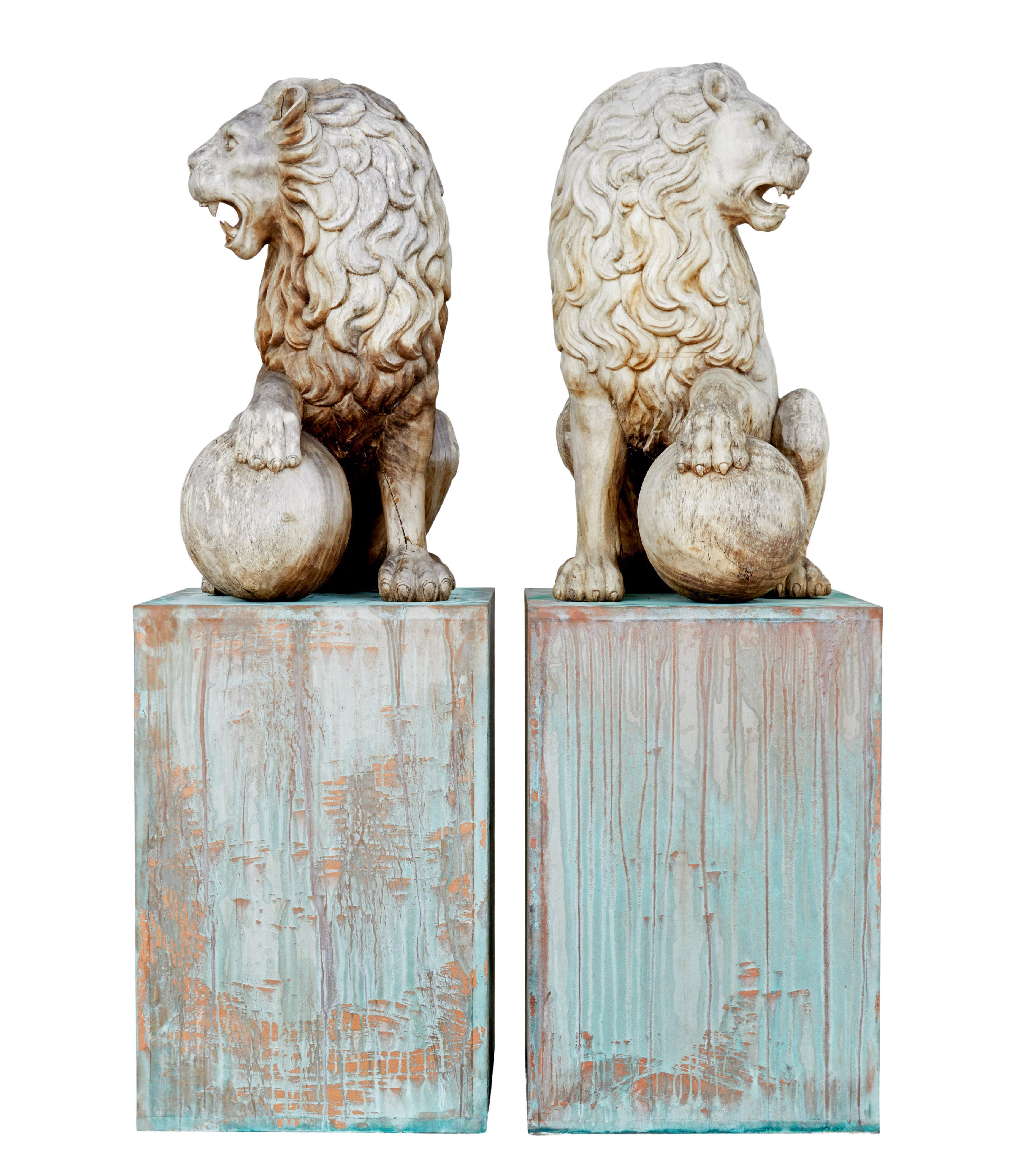 Pair of mid 20th century carved solid wood lions circa 1950.

Here we offer a fine pair of decorative carved lions for the ultimate installation piece.  Heavily carved out of solid wood, seated lions with 1 paw resting on a ball.  Presented on a