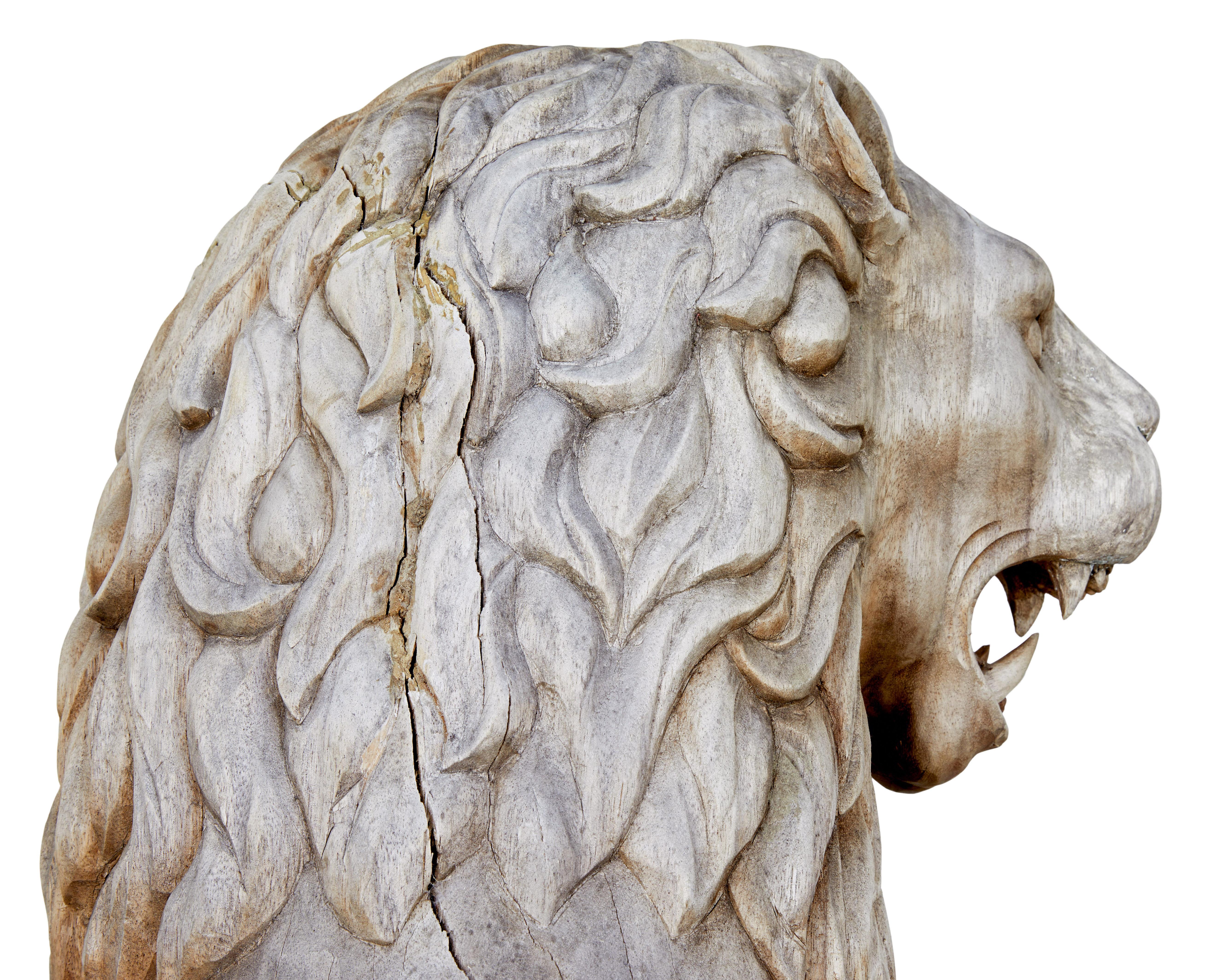 Carved Pair of mid 20th century carved solid wood lions For Sale
